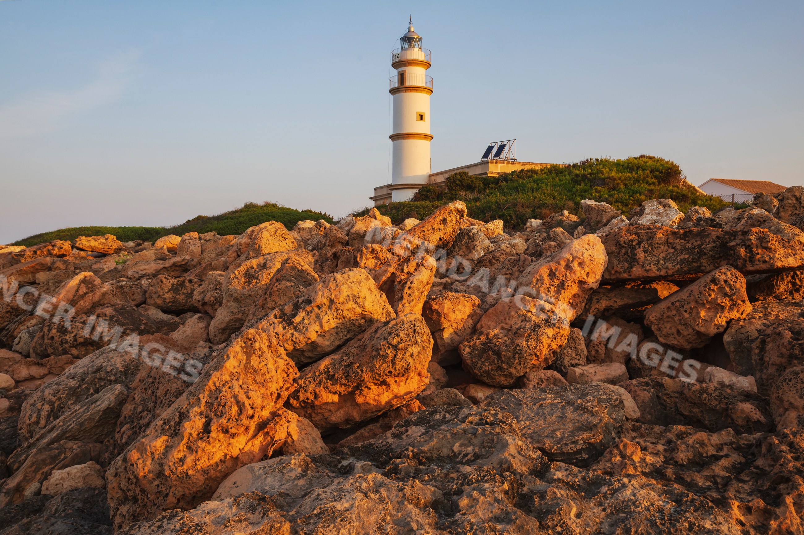 Lighthouse at Cabo de las Salinas on rocky coastline