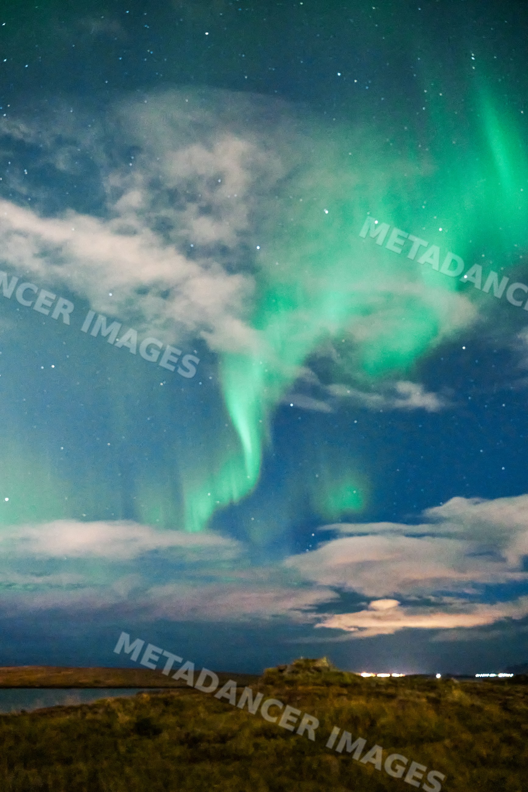 Aurora borealis lights up the night sky over Iceland landscape