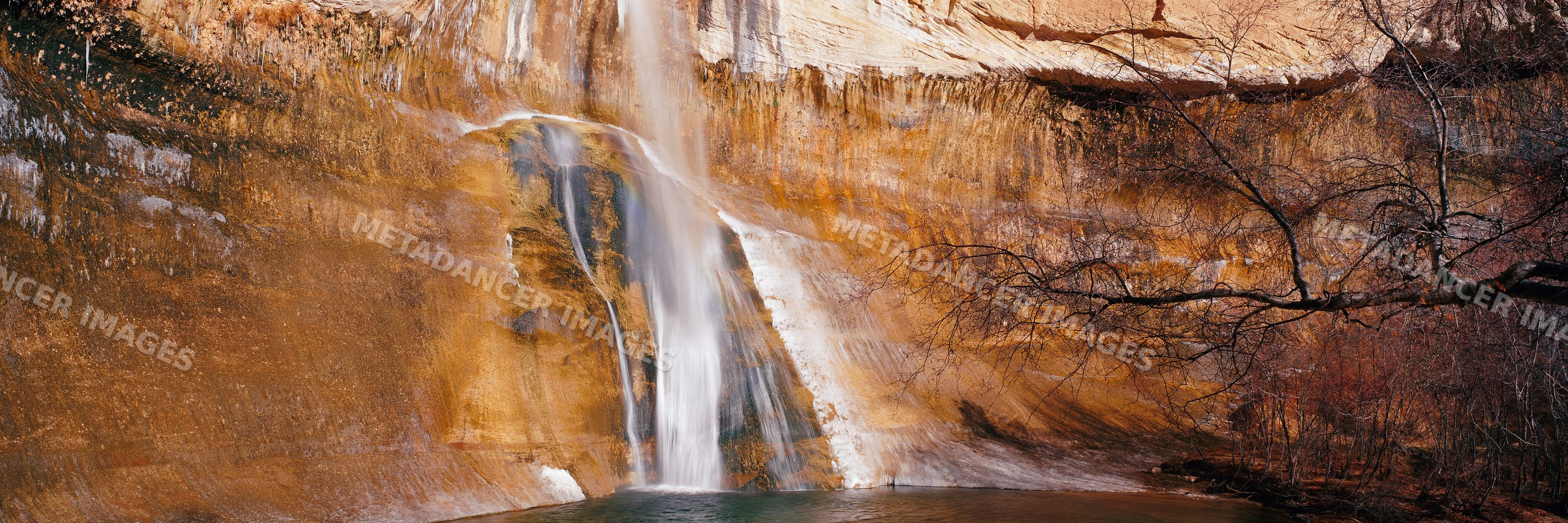 Waterfall cascading over cliff in escalante wilderness utah