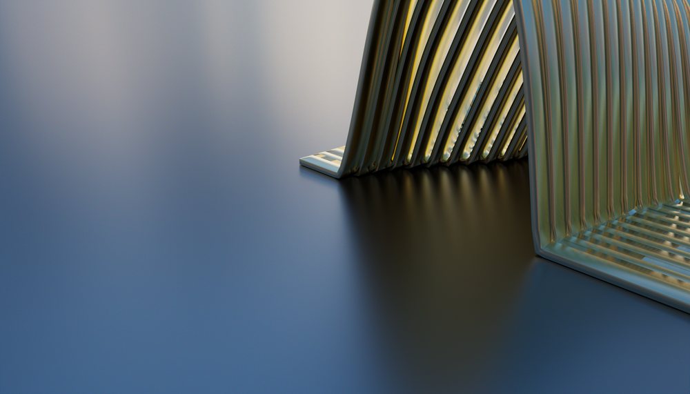 A close-up of a modern metallic abstract sculpture with geometric