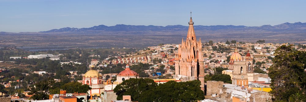 San miguel de allende cityscape with church towers and mountains
