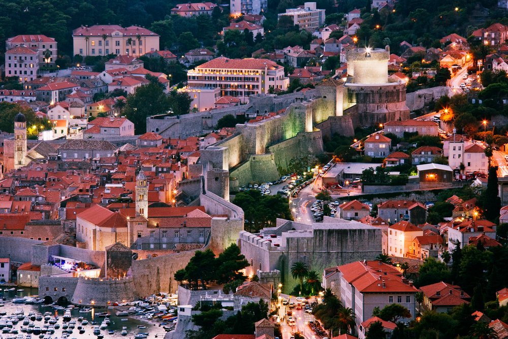Old city of dubrovnik with illuminated fortification walls