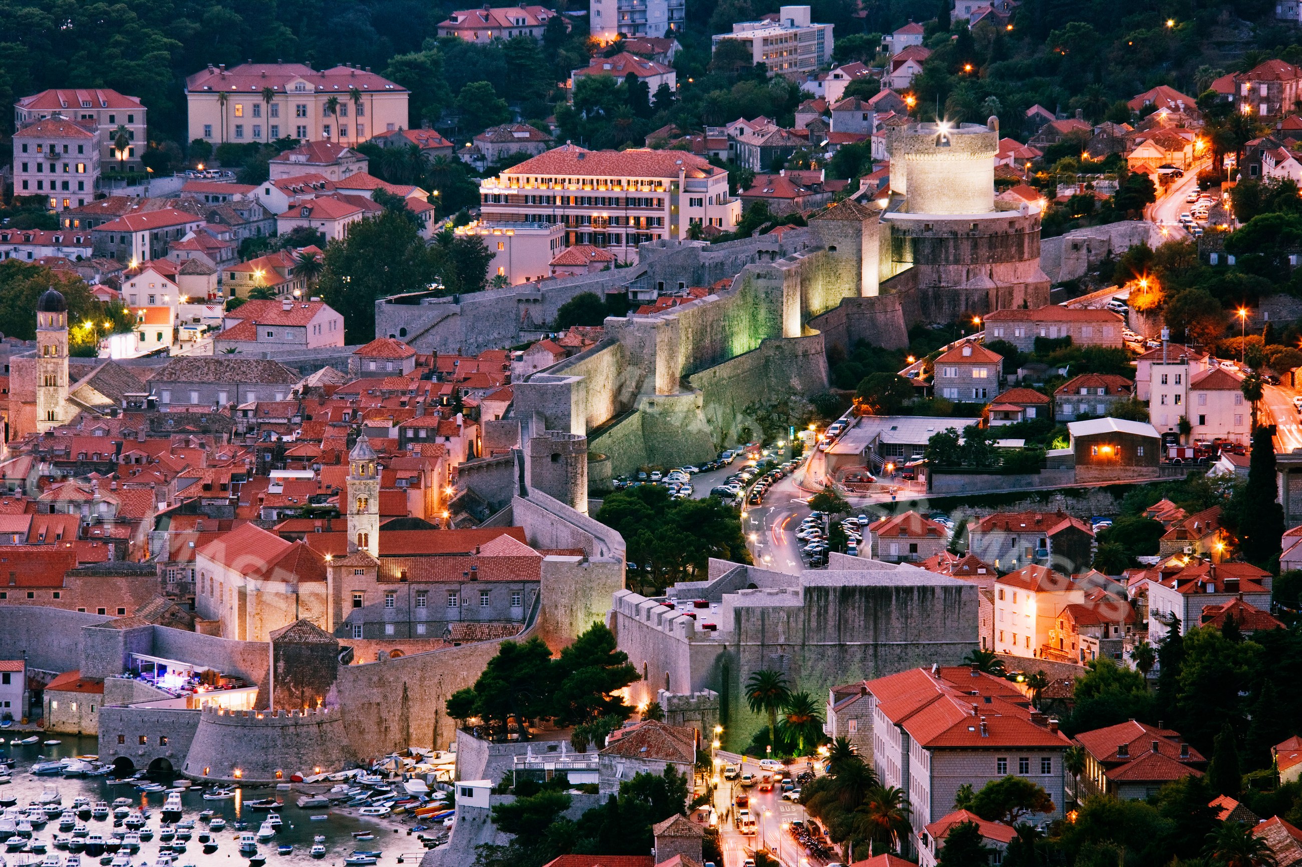Old city of dubrovnik with illuminated fortification walls