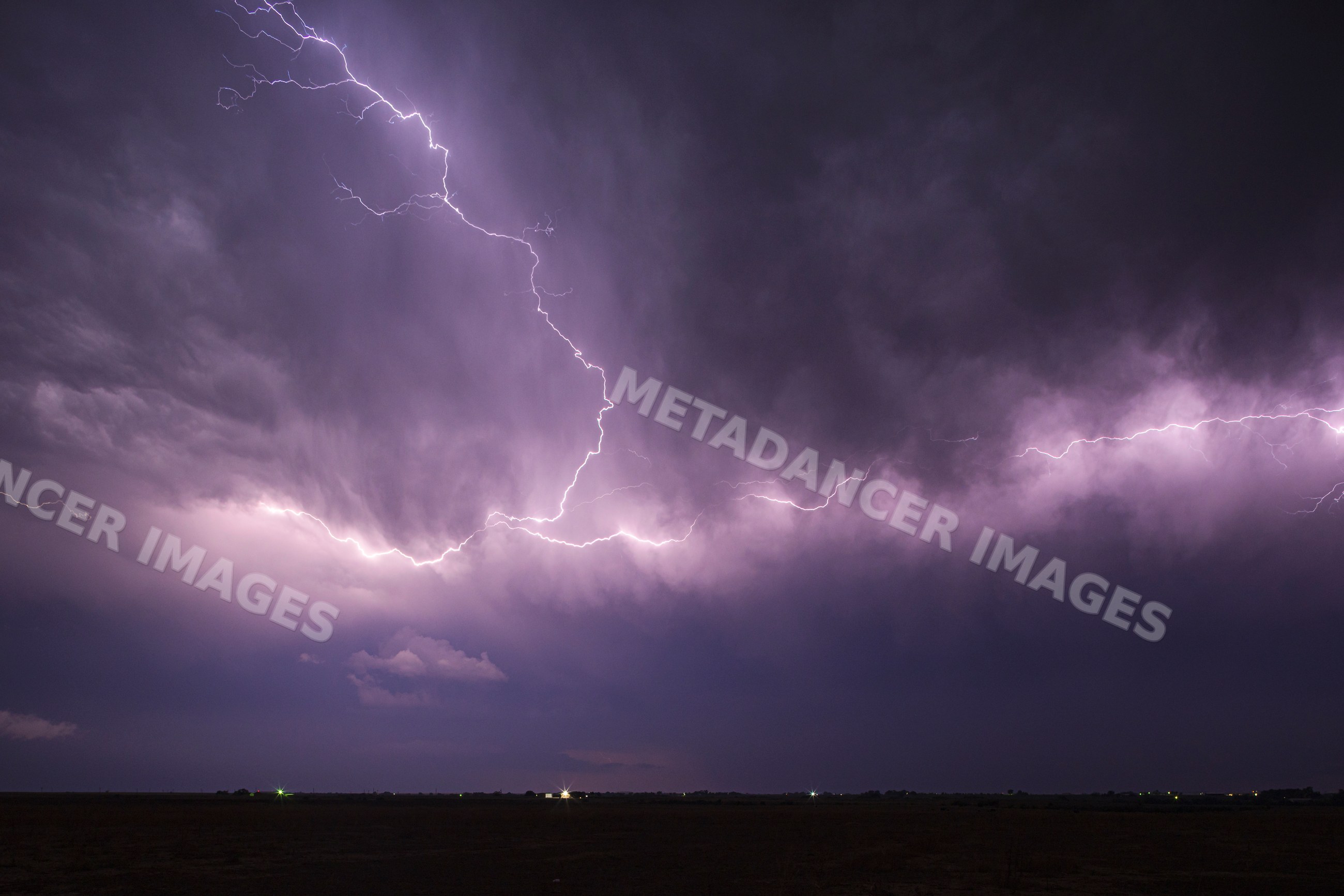 Lightning strike during storm at night in la junta colorado