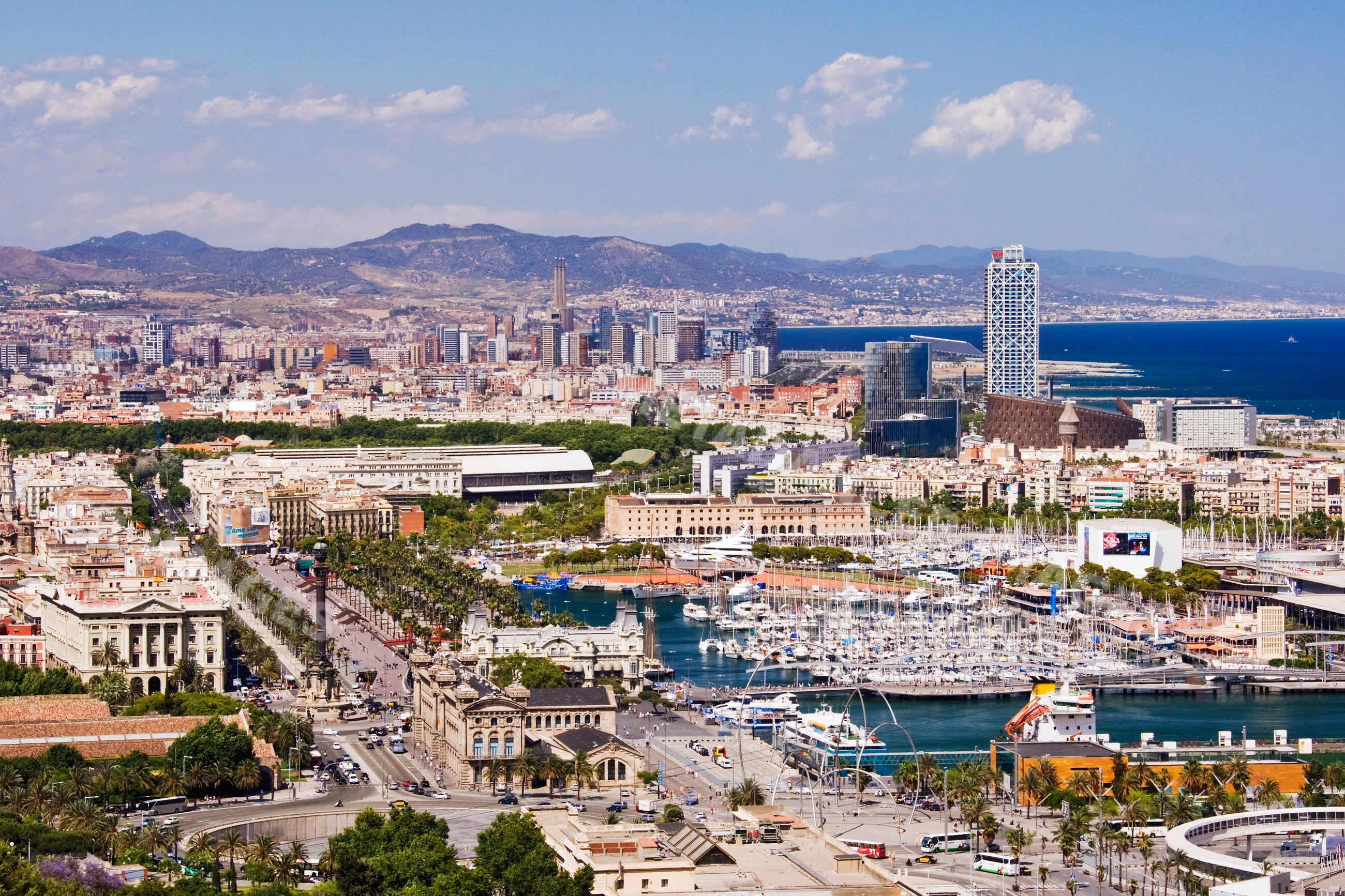 Barcelona cityscape with harbor marina and urban skyline