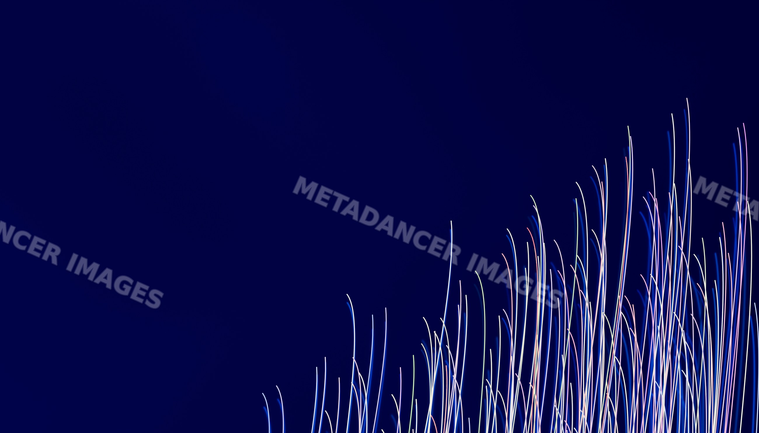 Light streaks forming colorful vertical lines on dark blue background