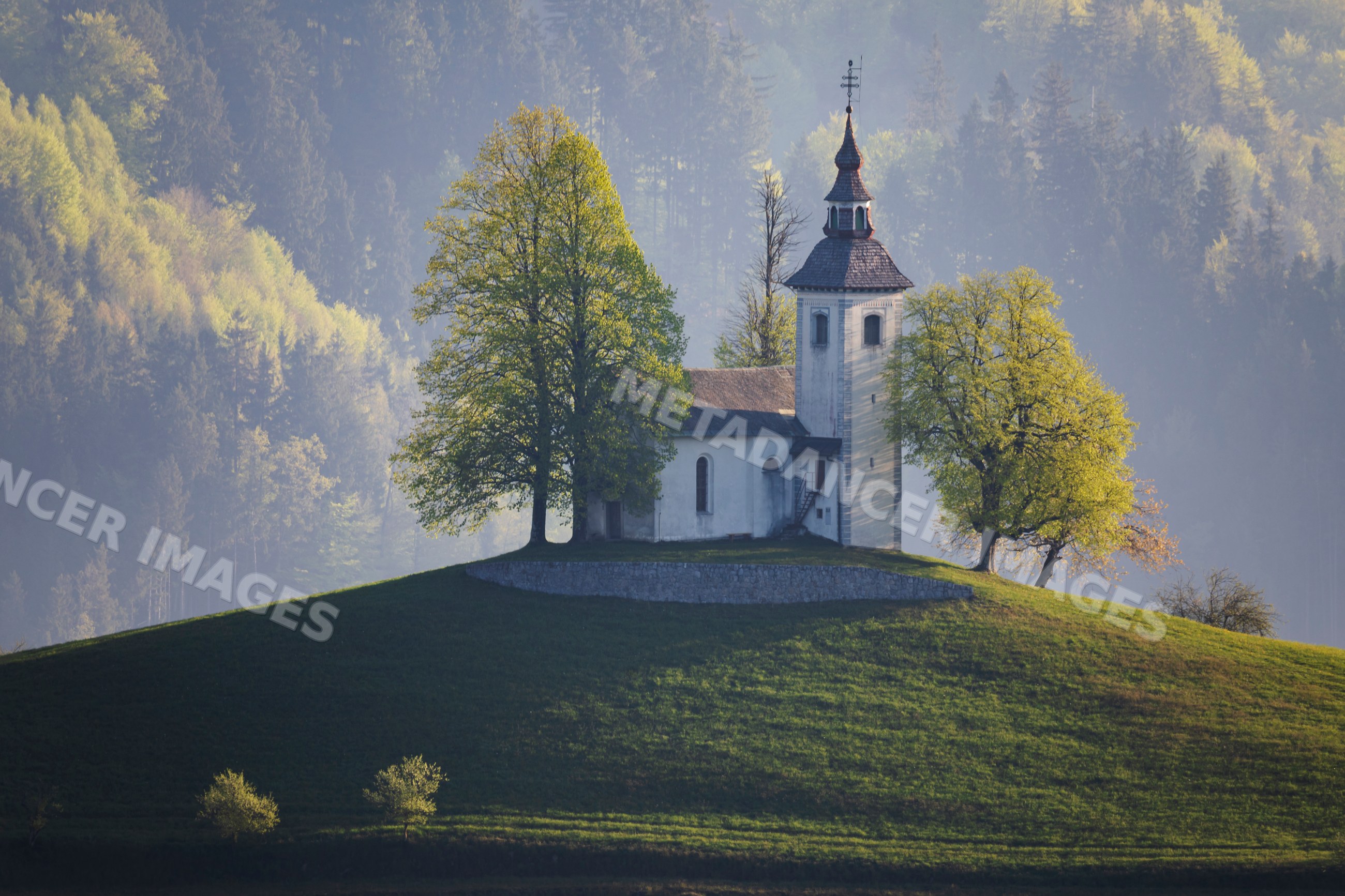 St thomas's church on hill at Sunrise in škofja loka Slovenia