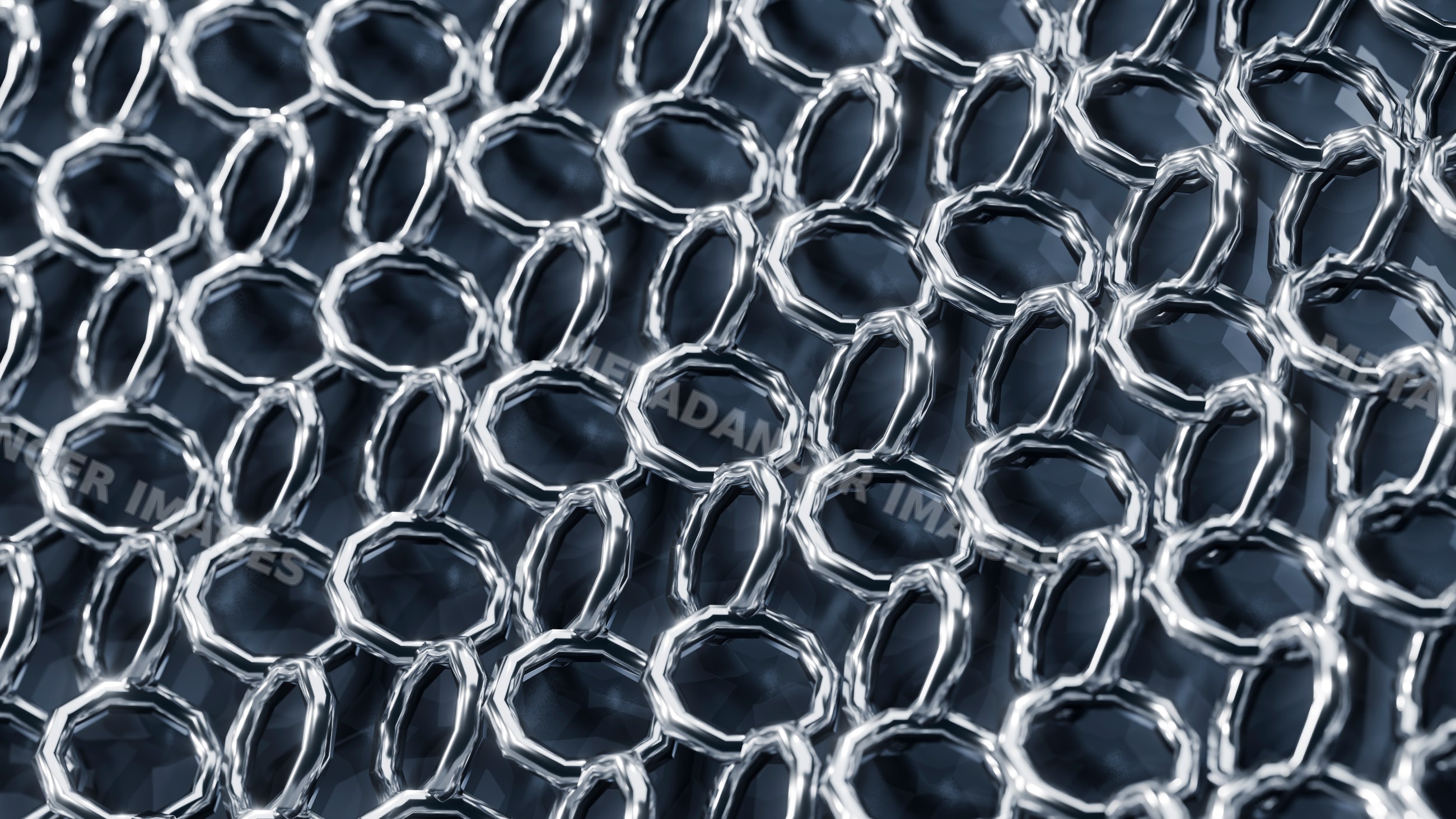 Close-up of interconnected metal rings forming chainmail pattern