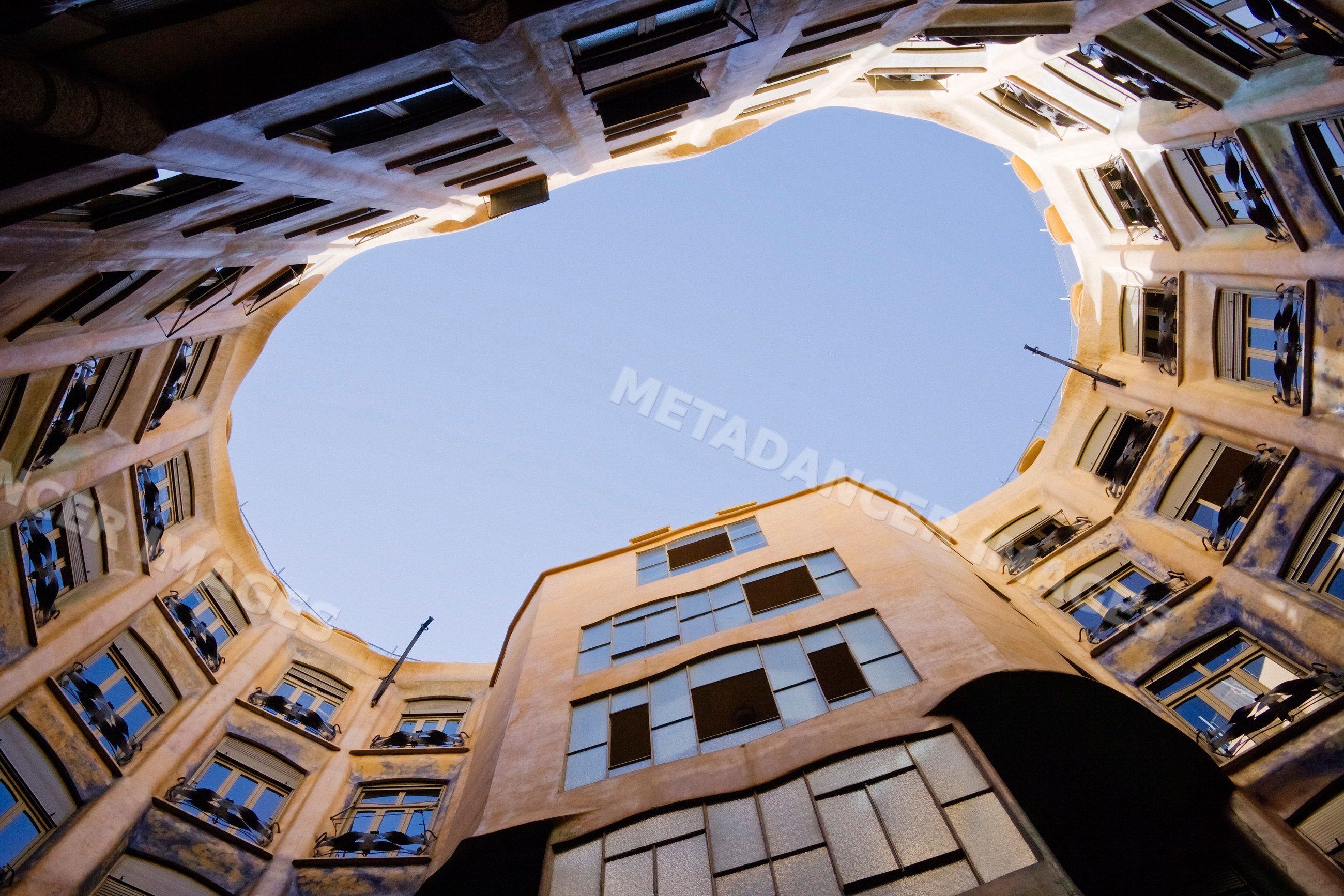 Atrium of casa mila with curved walls and balconies