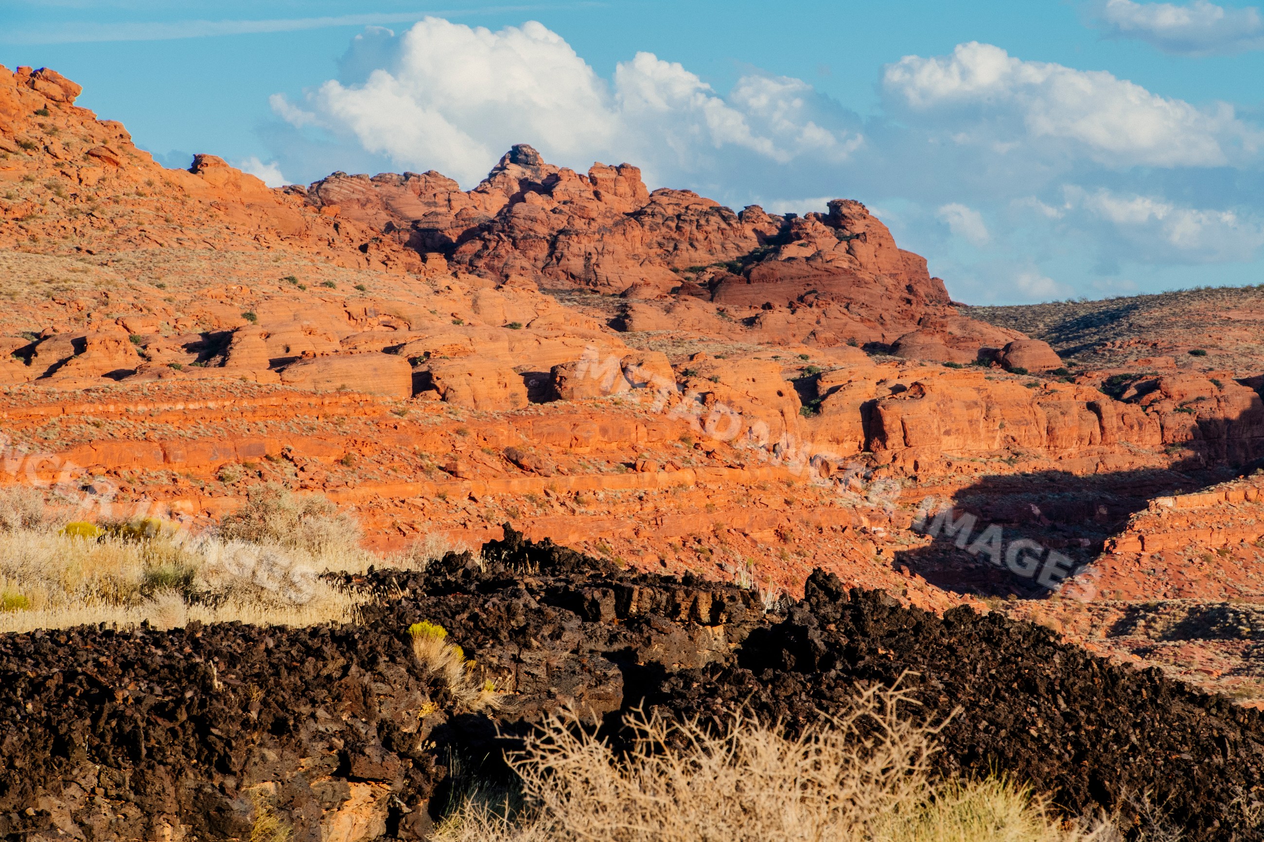 Red rock formations and volcanic terrain in Utah desert State Park