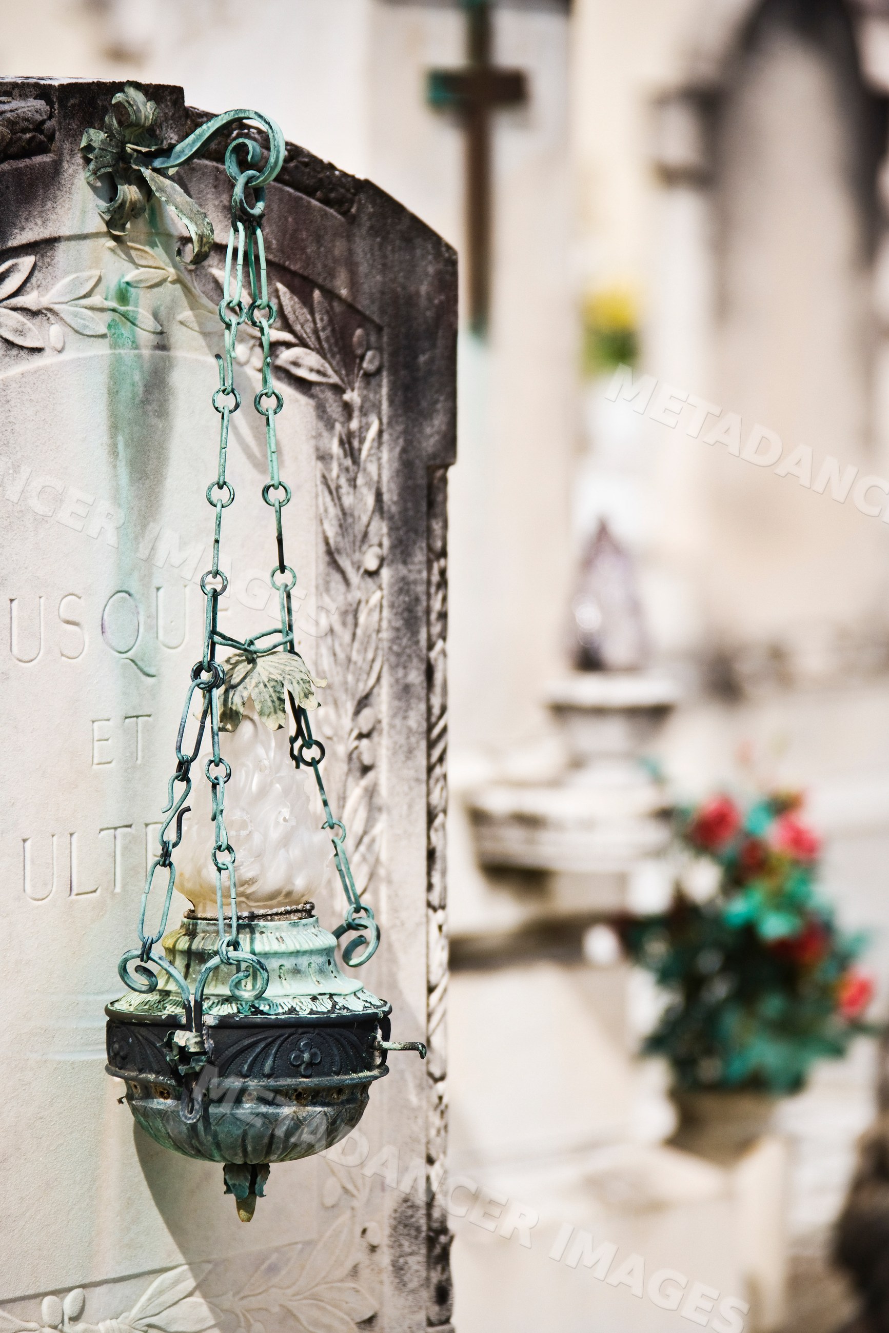Headstone with decorative lamp cemetery italy