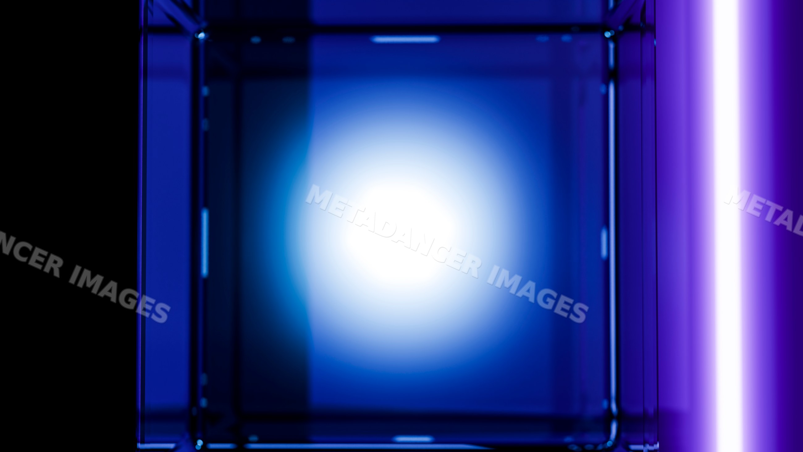 Blue glowing glass cube with neon light reflections