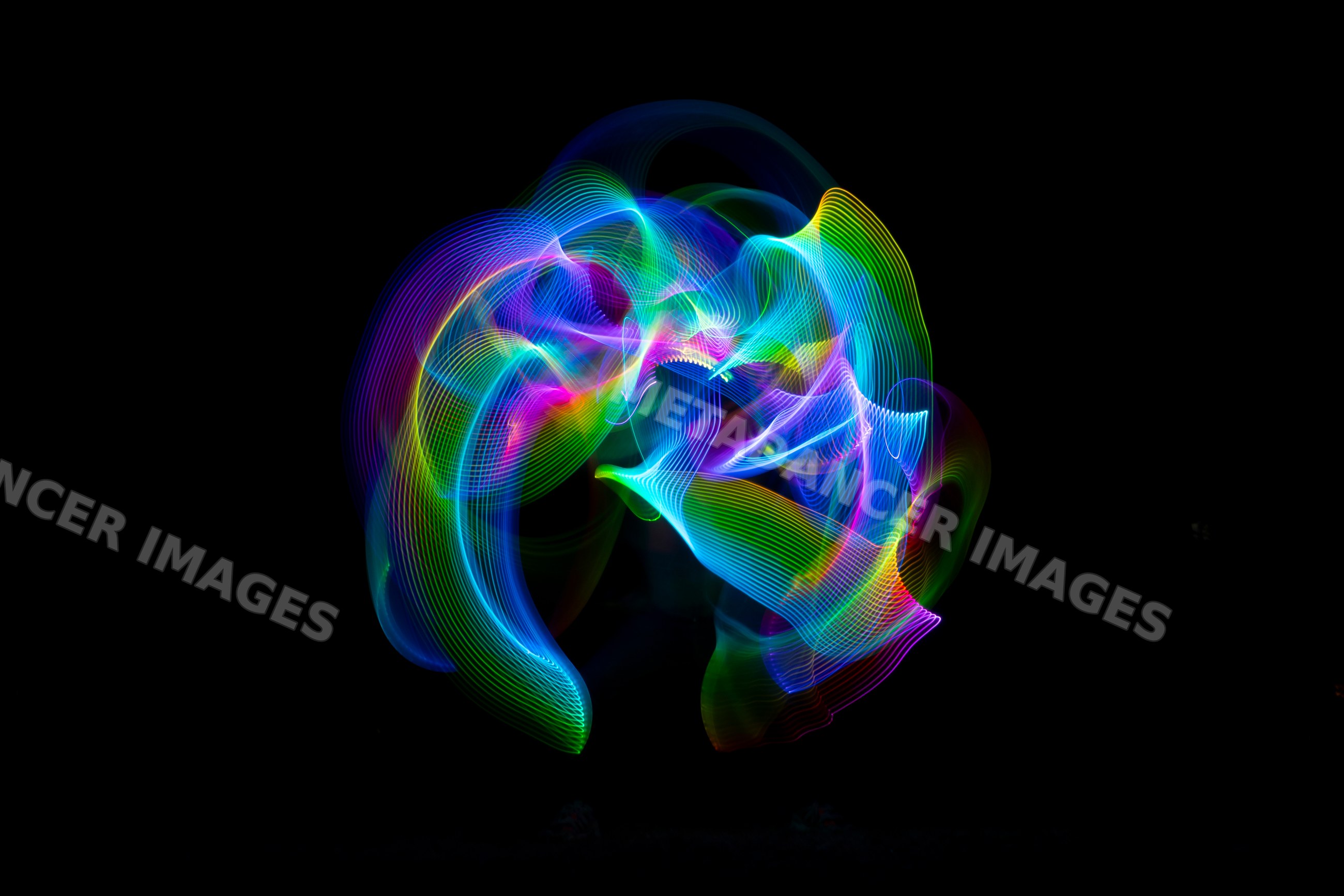 Colorful led light painting creating vibrant trails on a dark