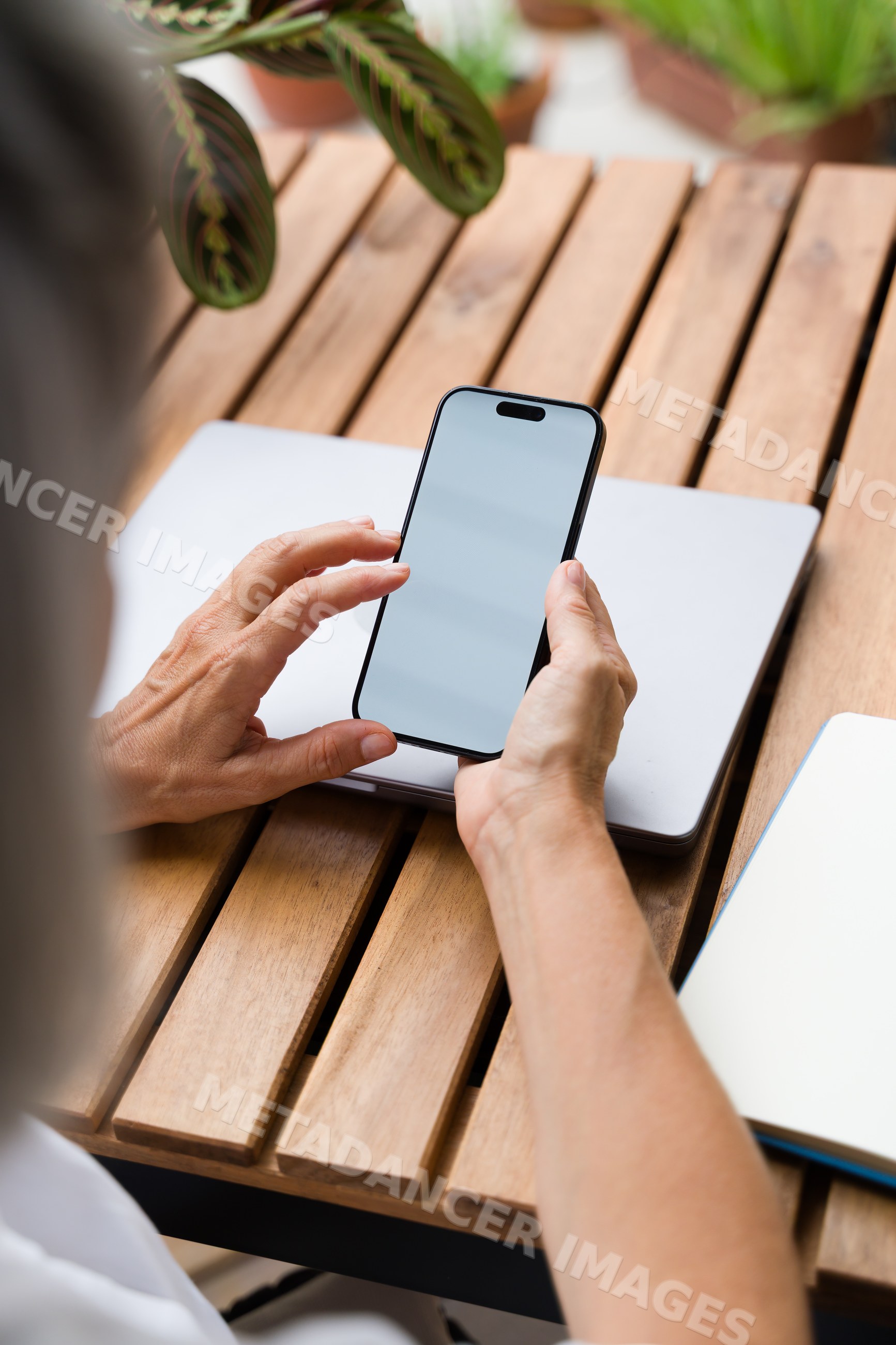 White Person holding smartphone