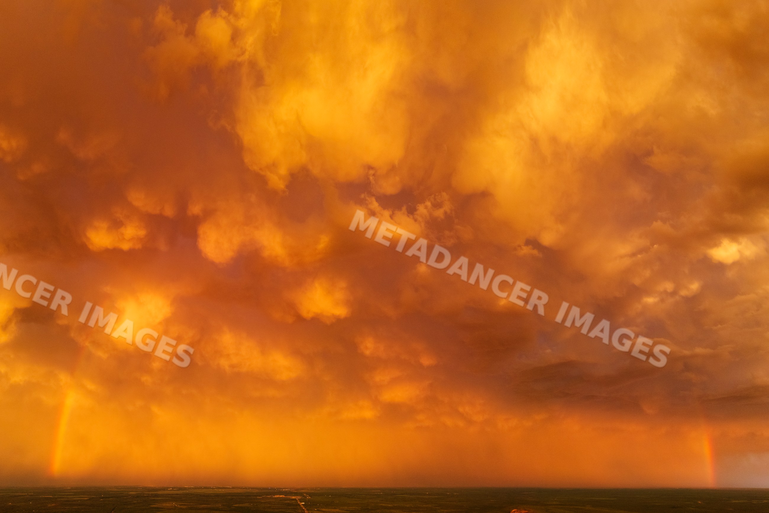 Rainbow under dramatic storm clouds at Sunset over Uvalde texas