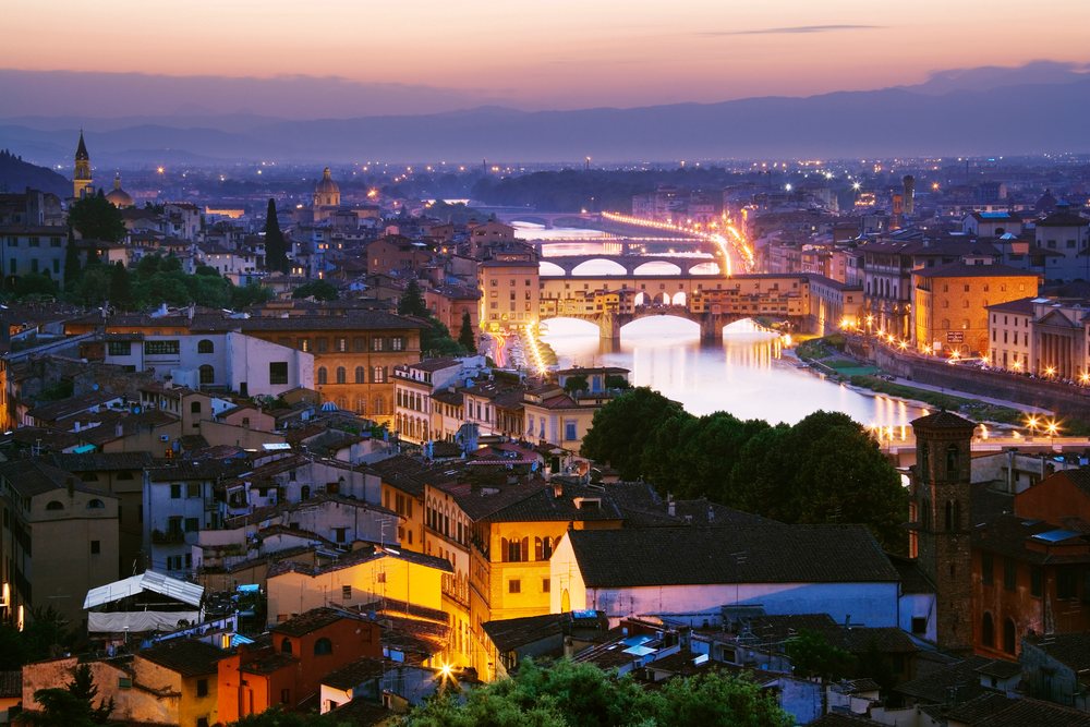 Cityscape of florence with arno river at dusk