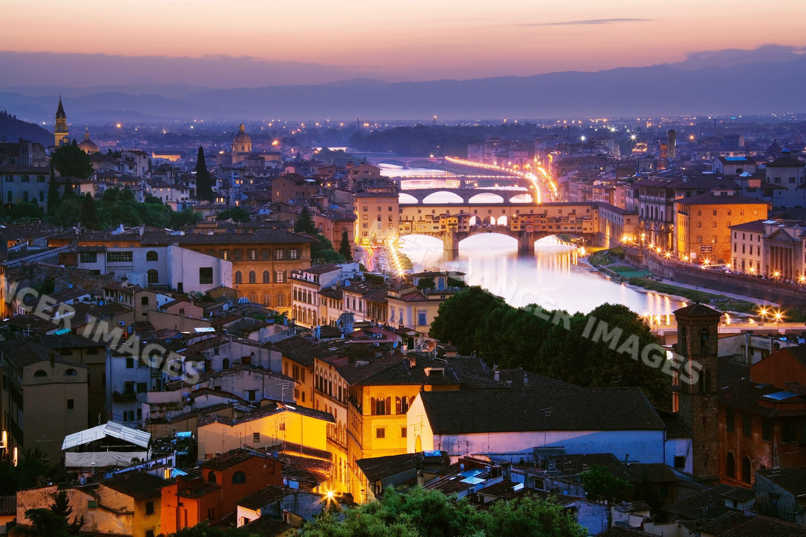 Cityscape of florence with arno river at dusk
