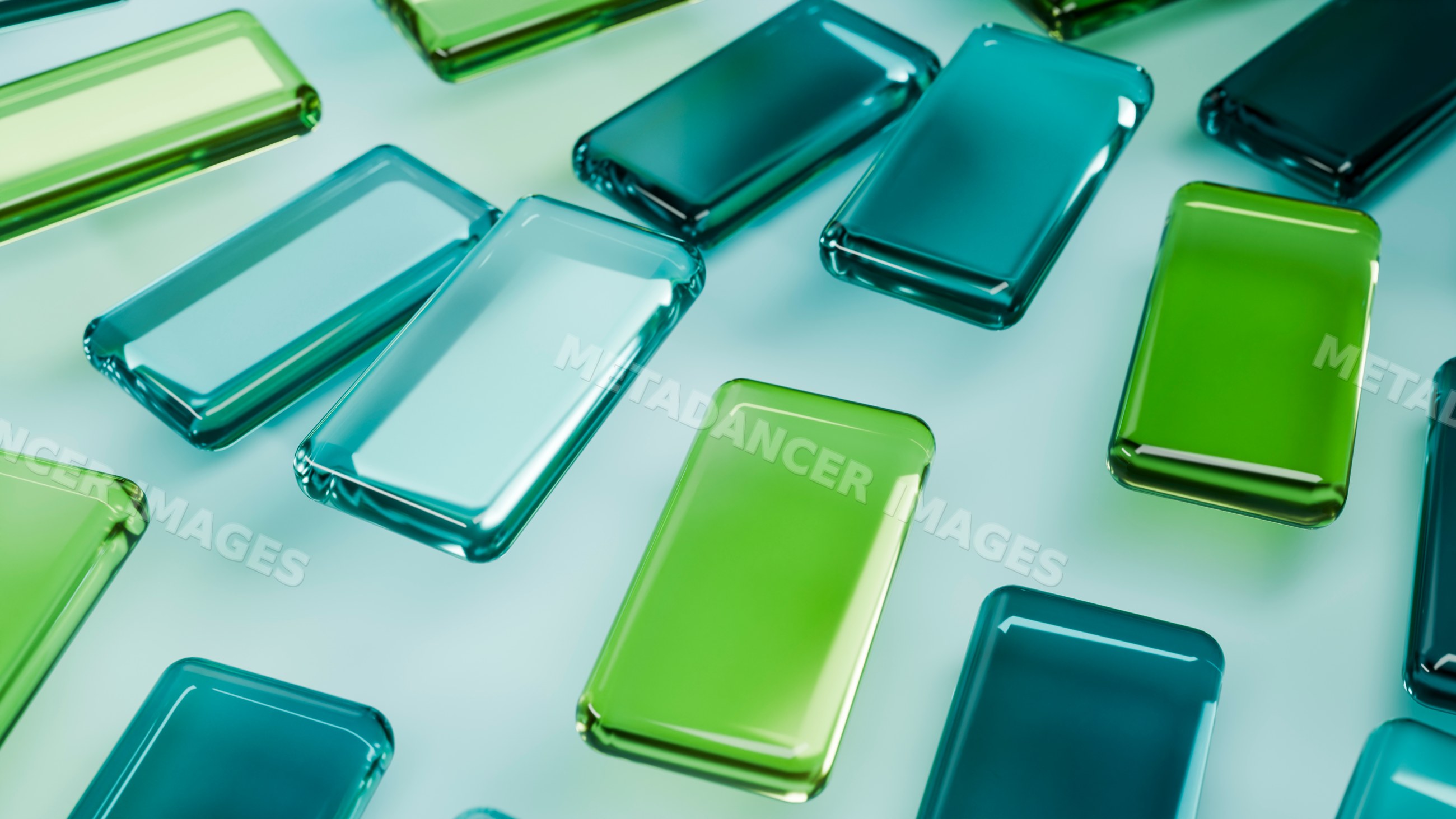 Colorful green and blue rectangular glass blocks arranged on surface