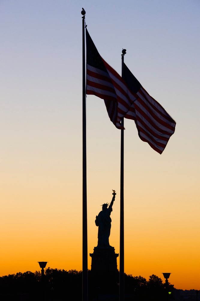 Statue of liberty silhouette on liberty island