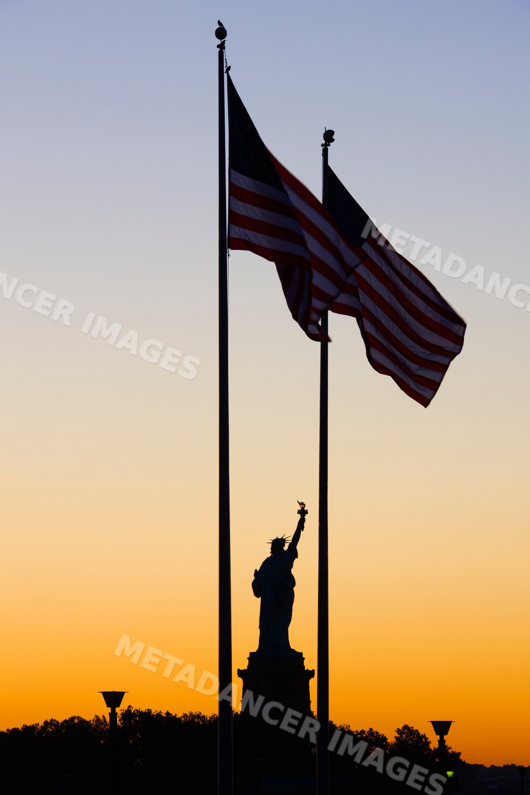 Statue of liberty silhouette on liberty island
