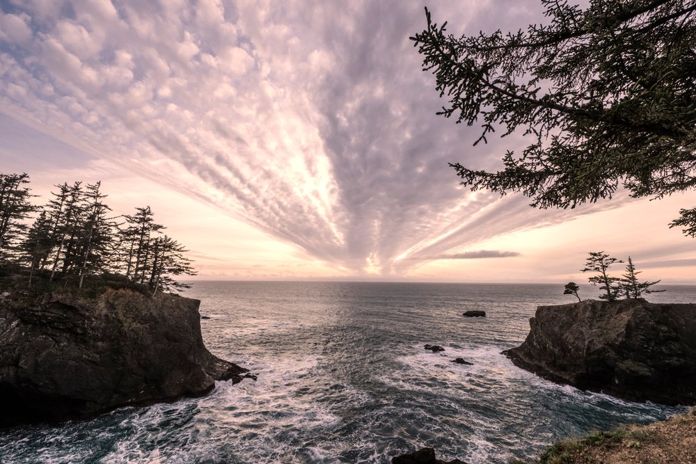 Ocean waves and rocky cliffs at sunset