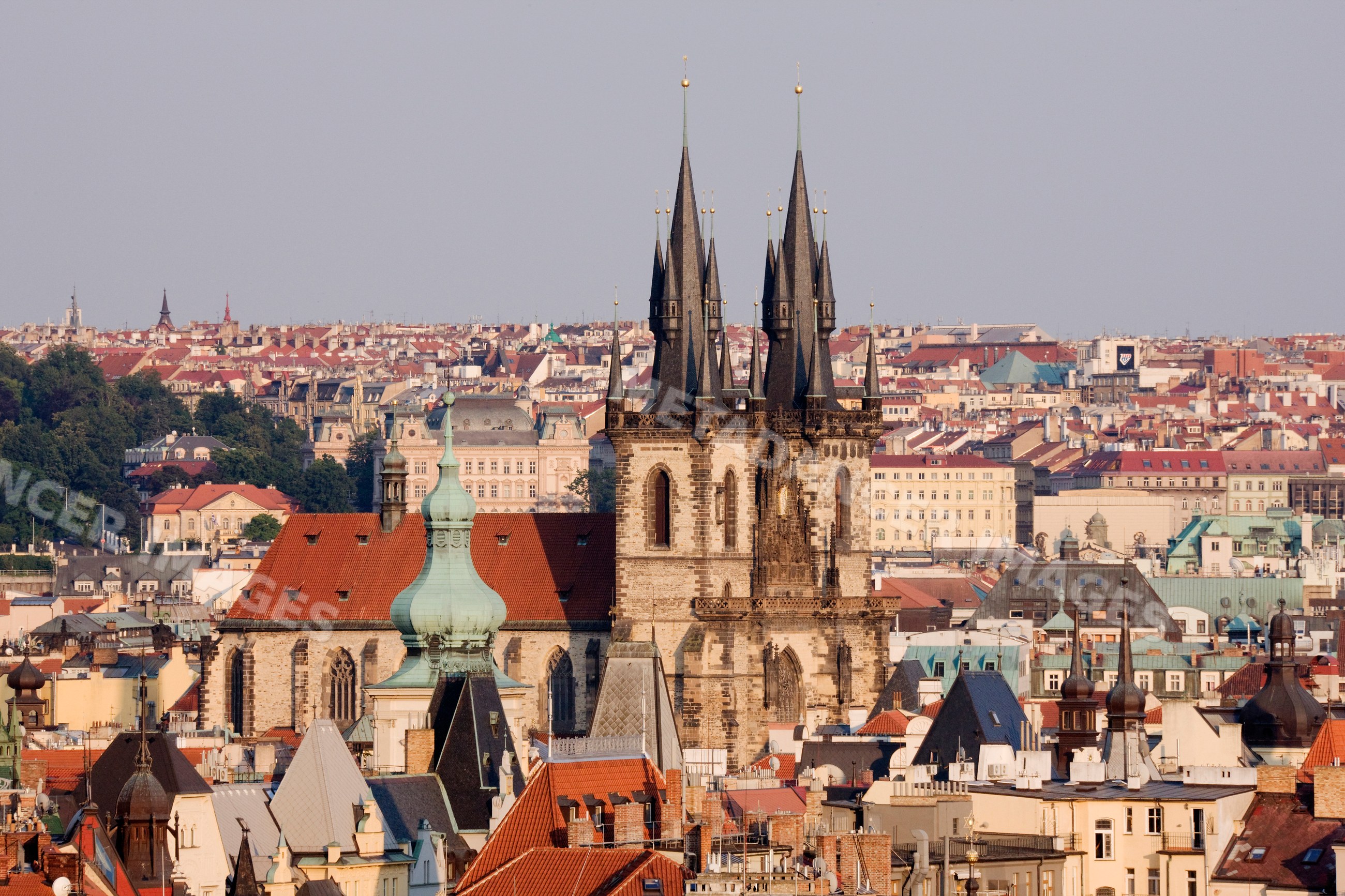 Tyn church gothic spires above rooftops old town