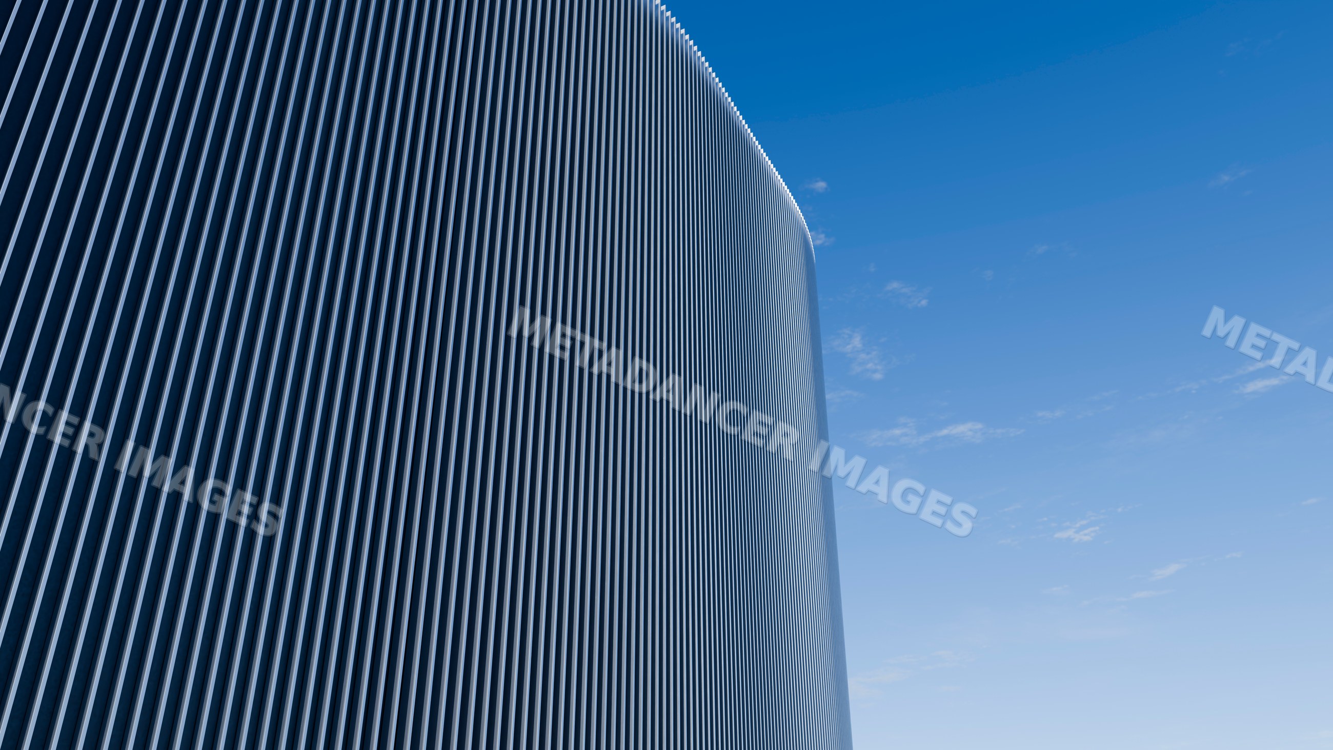 Curved modern building with vertical lines facade under blue sky