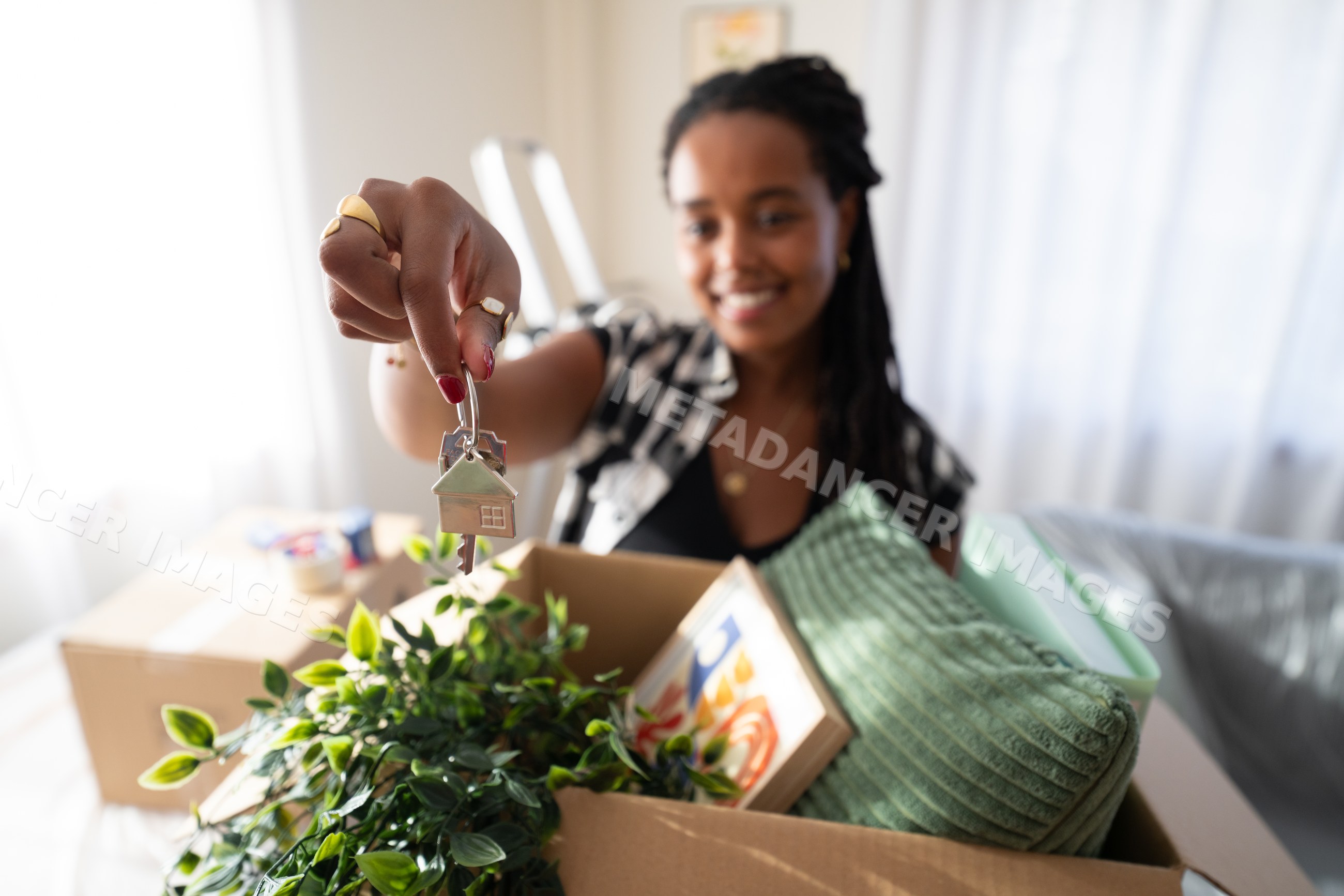 A African American woman holding house keys