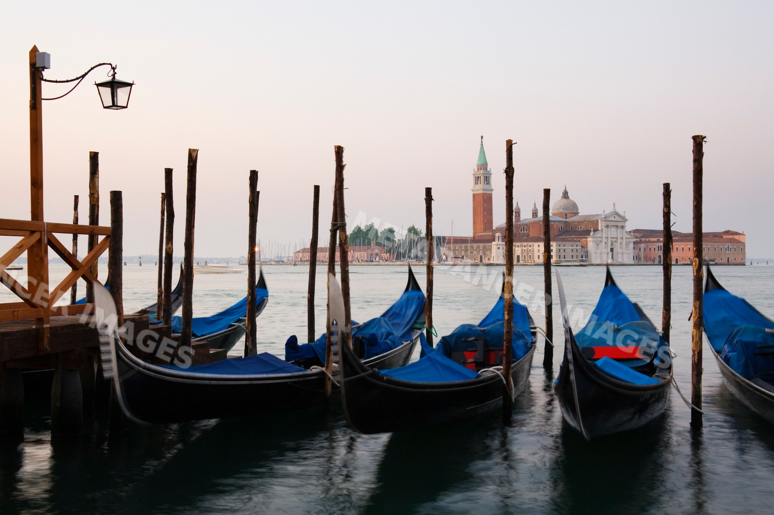 Gondolas moored with san giorgio maggiore in venice