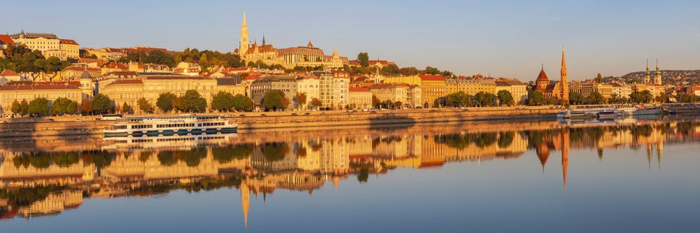 Skyline of Buda at Sunrise with river reflections