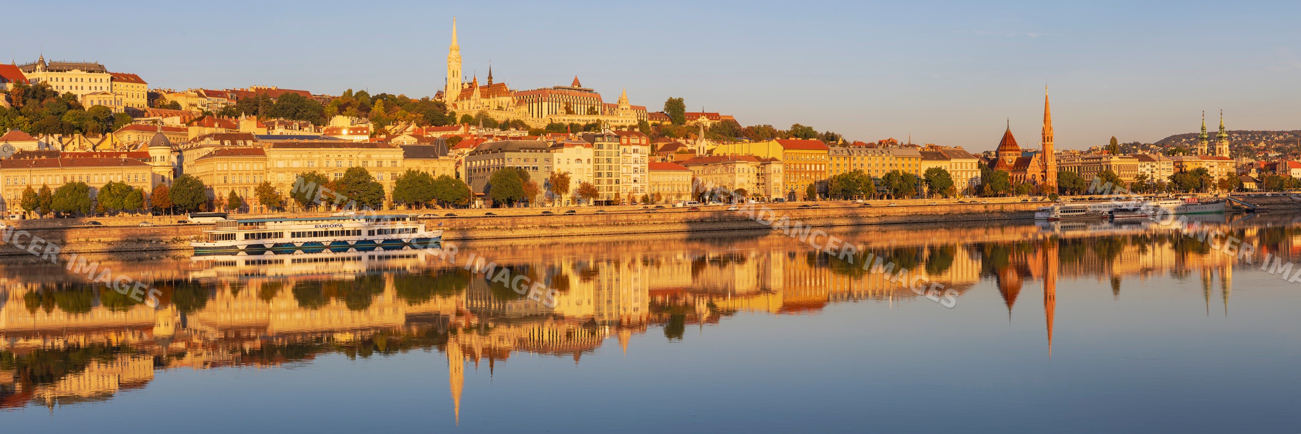 Skyline of Buda at Sunrise with river reflections