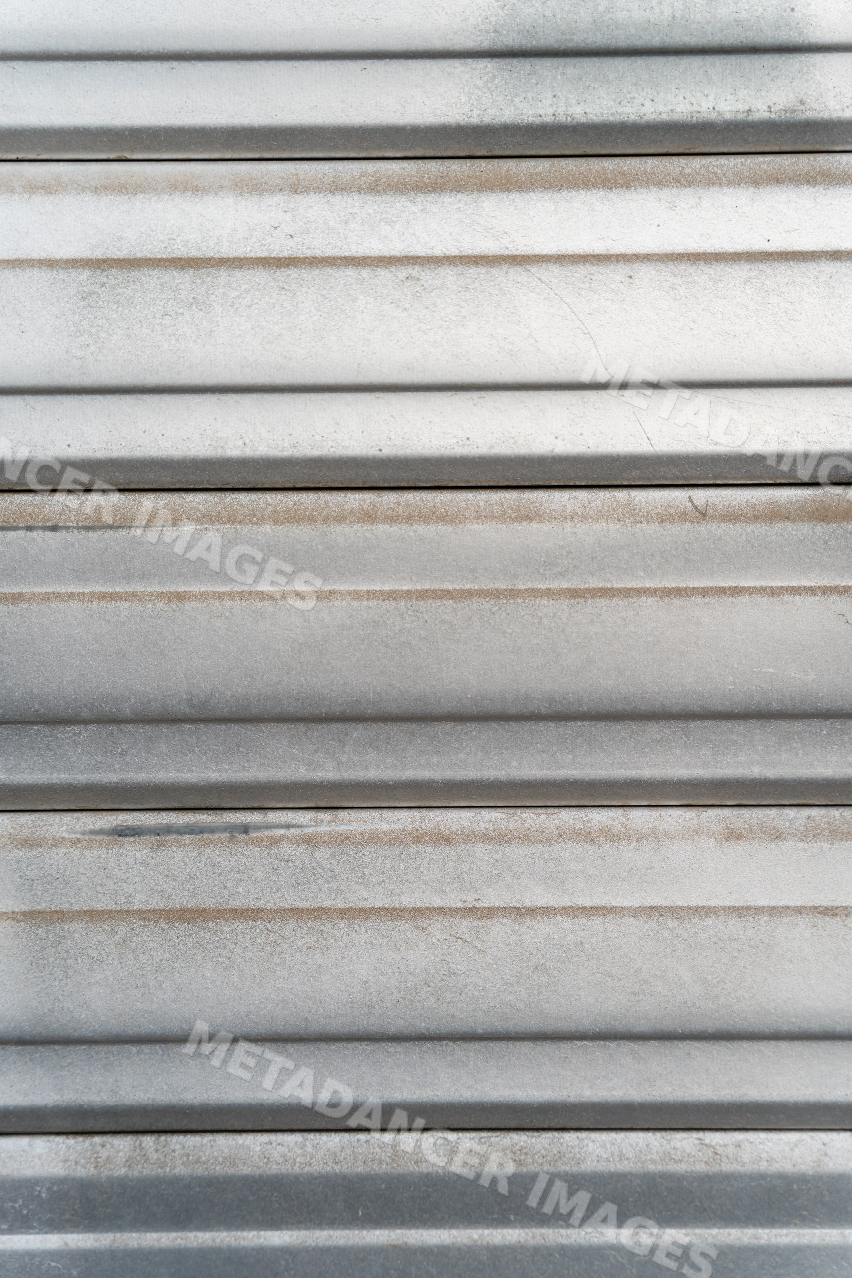 Corrugated metal surface with weathered horizontal stripes and texture