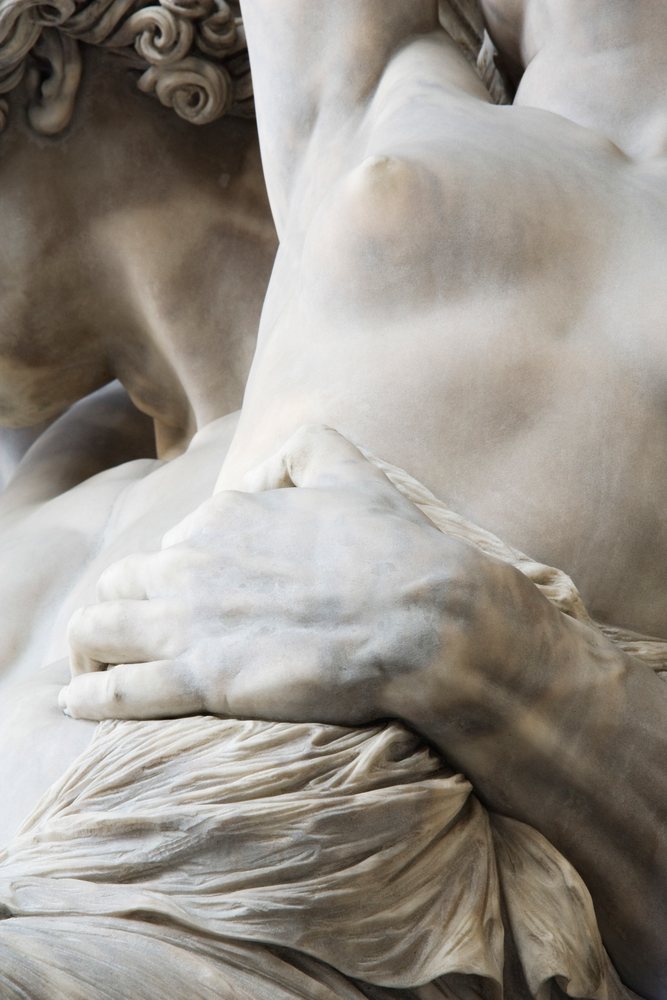 Close-up of marble sculpture hand and torso italy