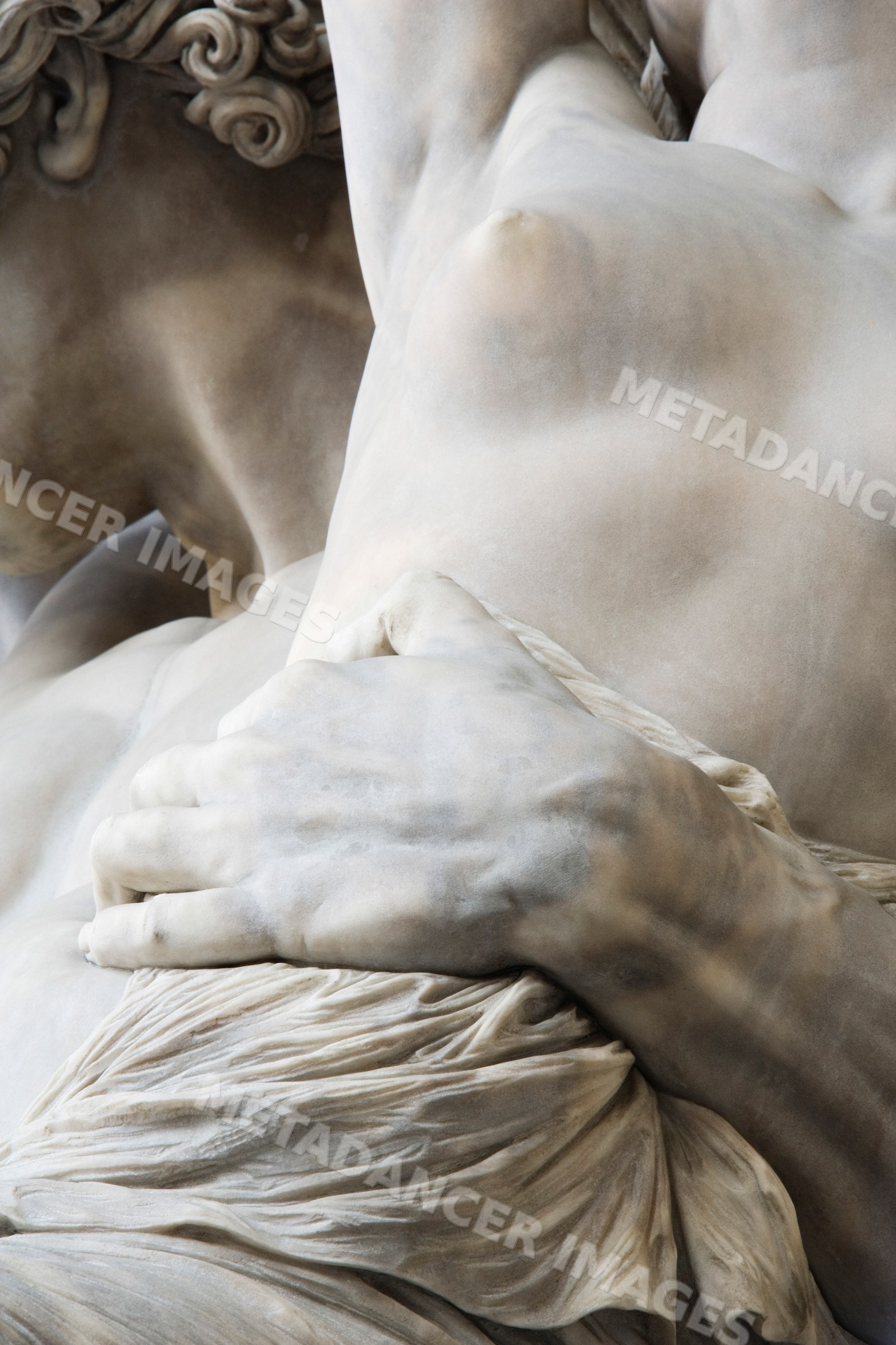 Close-up of marble sculpture hand and torso italy