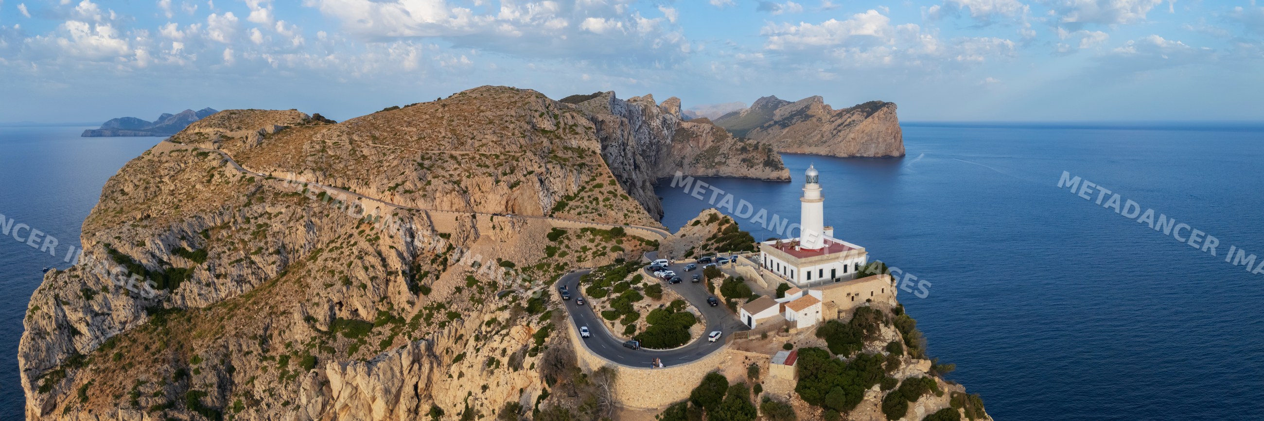Far de Formentor Lighthouse on rocky cliffs at sunrise in Mallorca