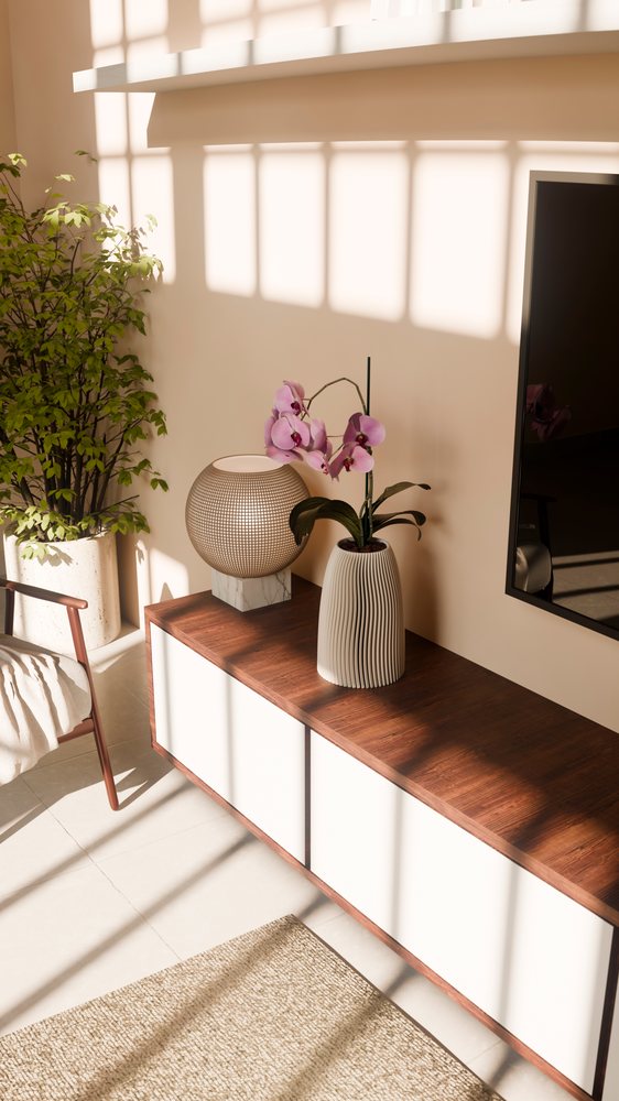 Orchid flower in ceramic vase on wooden table in modern living room