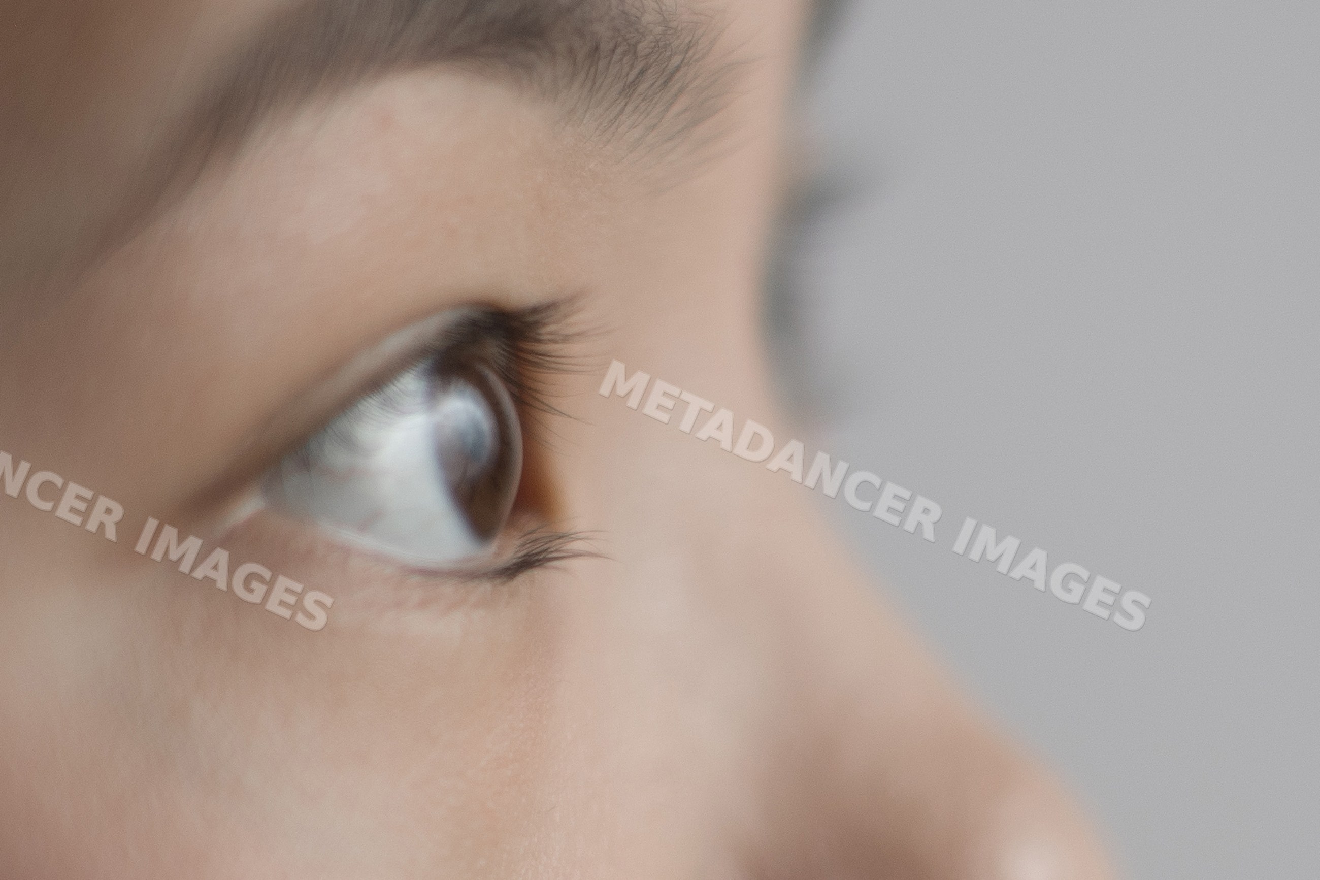 Close-up profile of Southeast Asian boy's eye