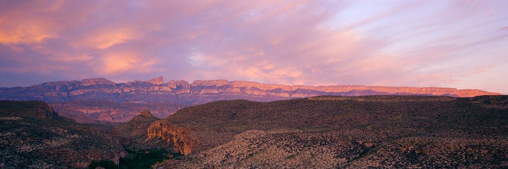 Mountain range at sunset in desert landscape