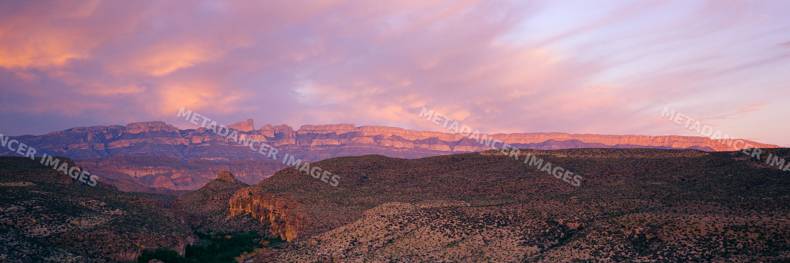 Mountain range at sunset in desert landscape