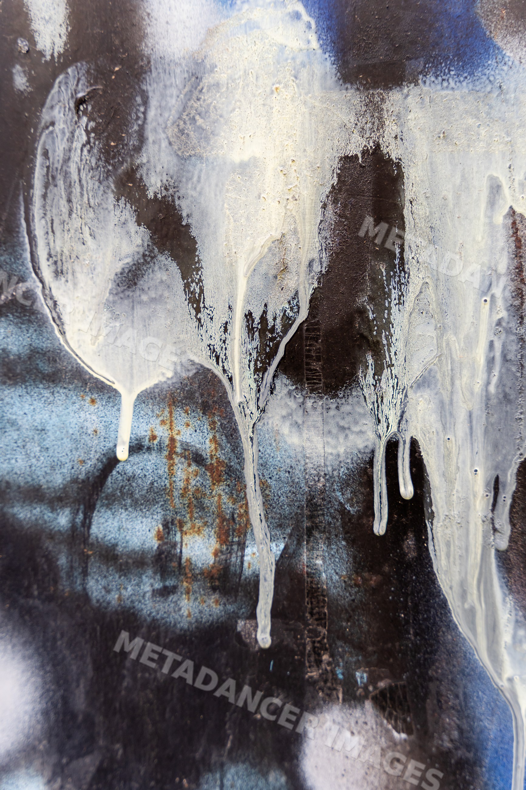 Abstract textured surface with dripping paint and rust stains