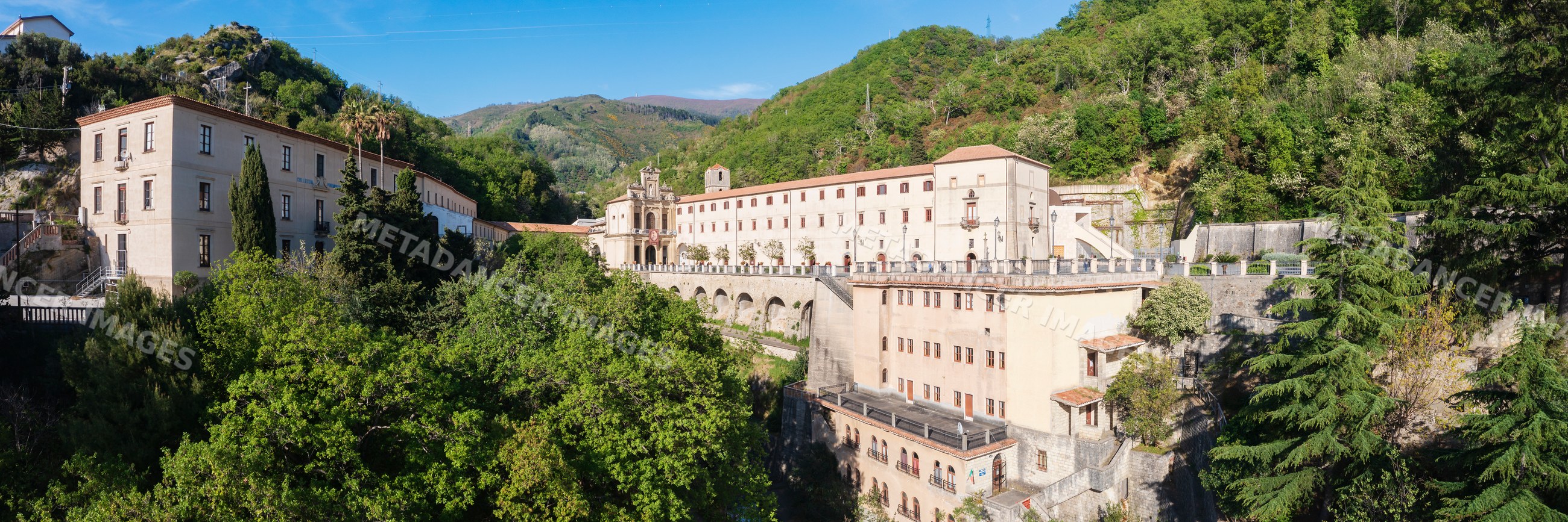 Santuario di san francesco di Paola church on lush hillside in Paola