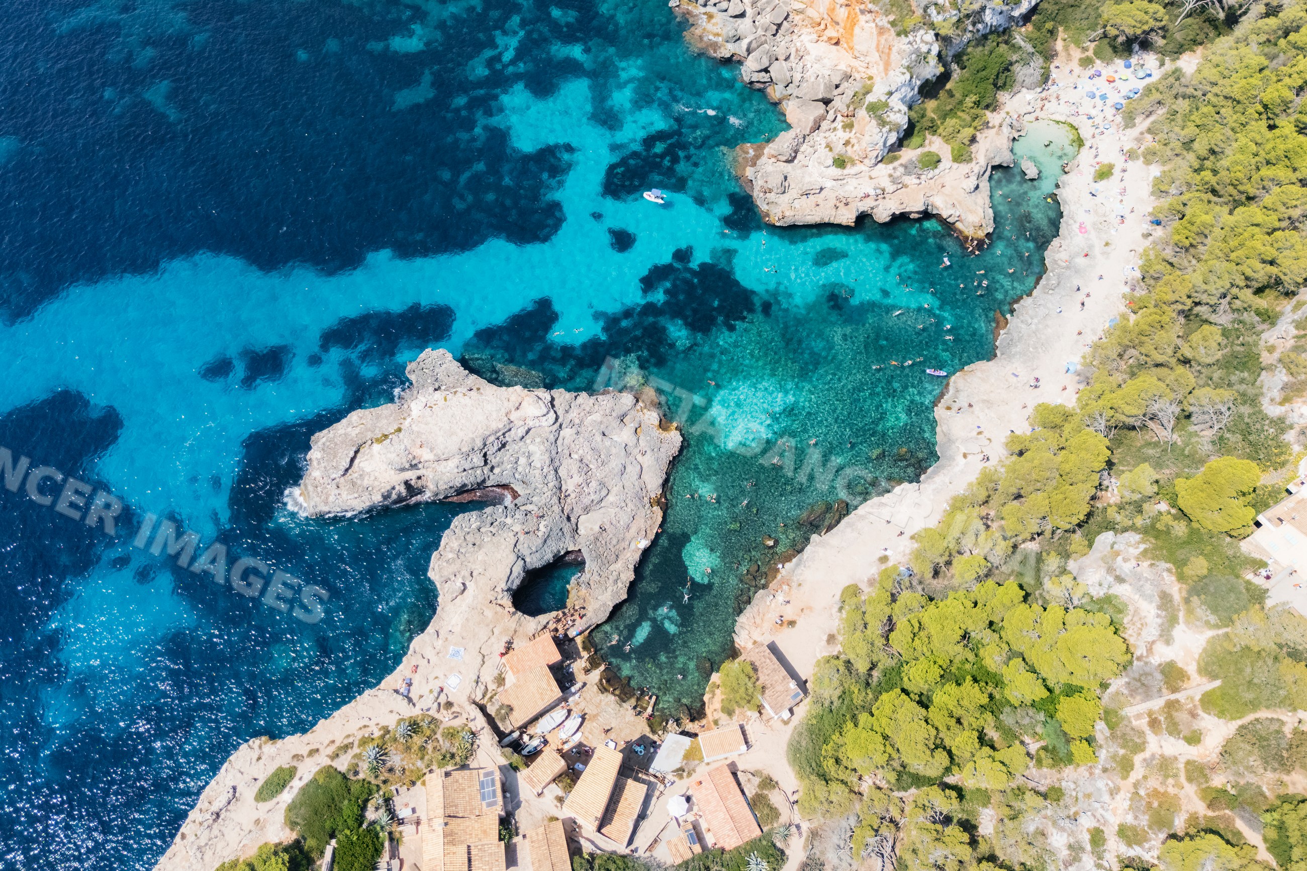 Aerial view of Cala s'Almunia beach and rocky coastline in Mallorca