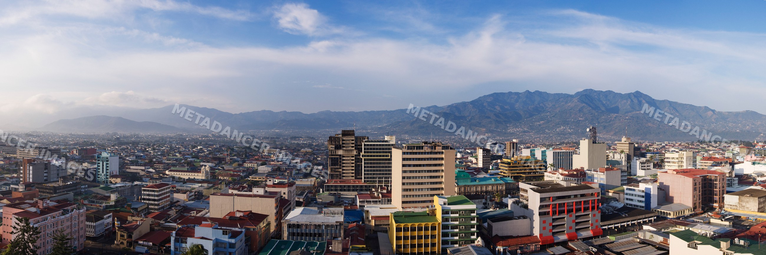 Panoramic cityscape of san jose with urban buildings and mountains