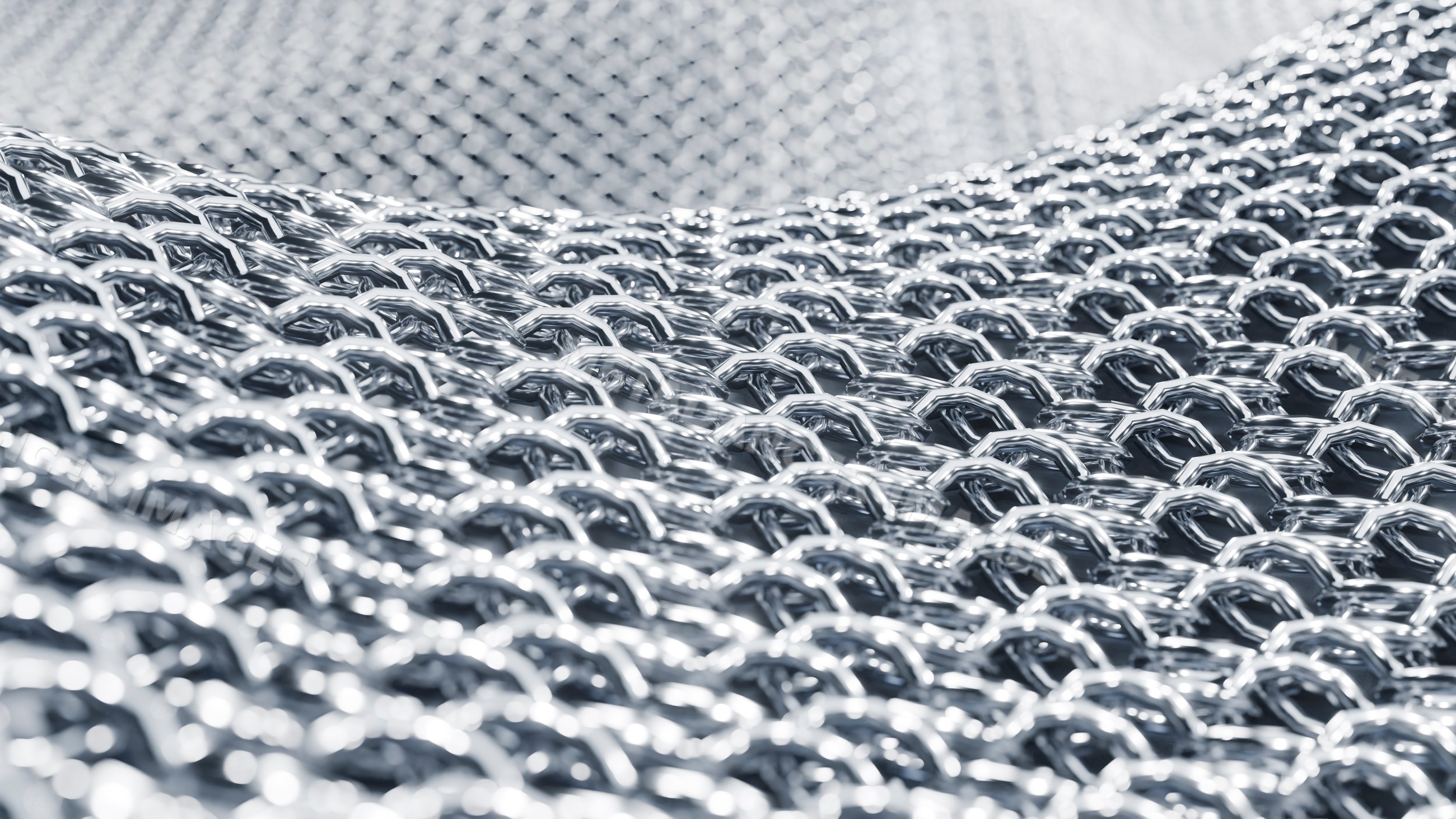 Close-up of interlinked metal rings forming chainmail armor