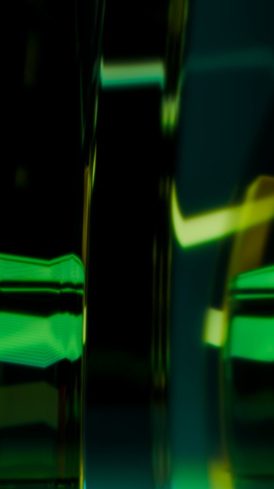 Abstract green and yellow glass reflections with blurred light