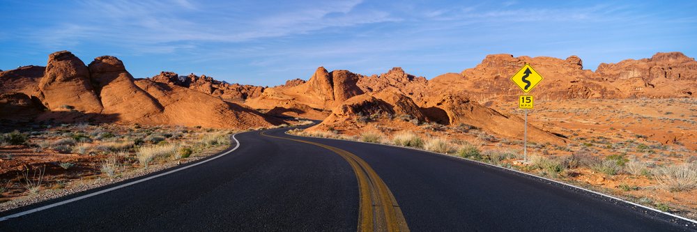 Winding road through desert rock formations, USA