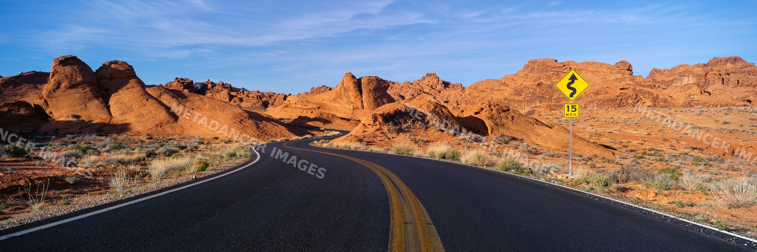 Winding road through desert rock formations, USA