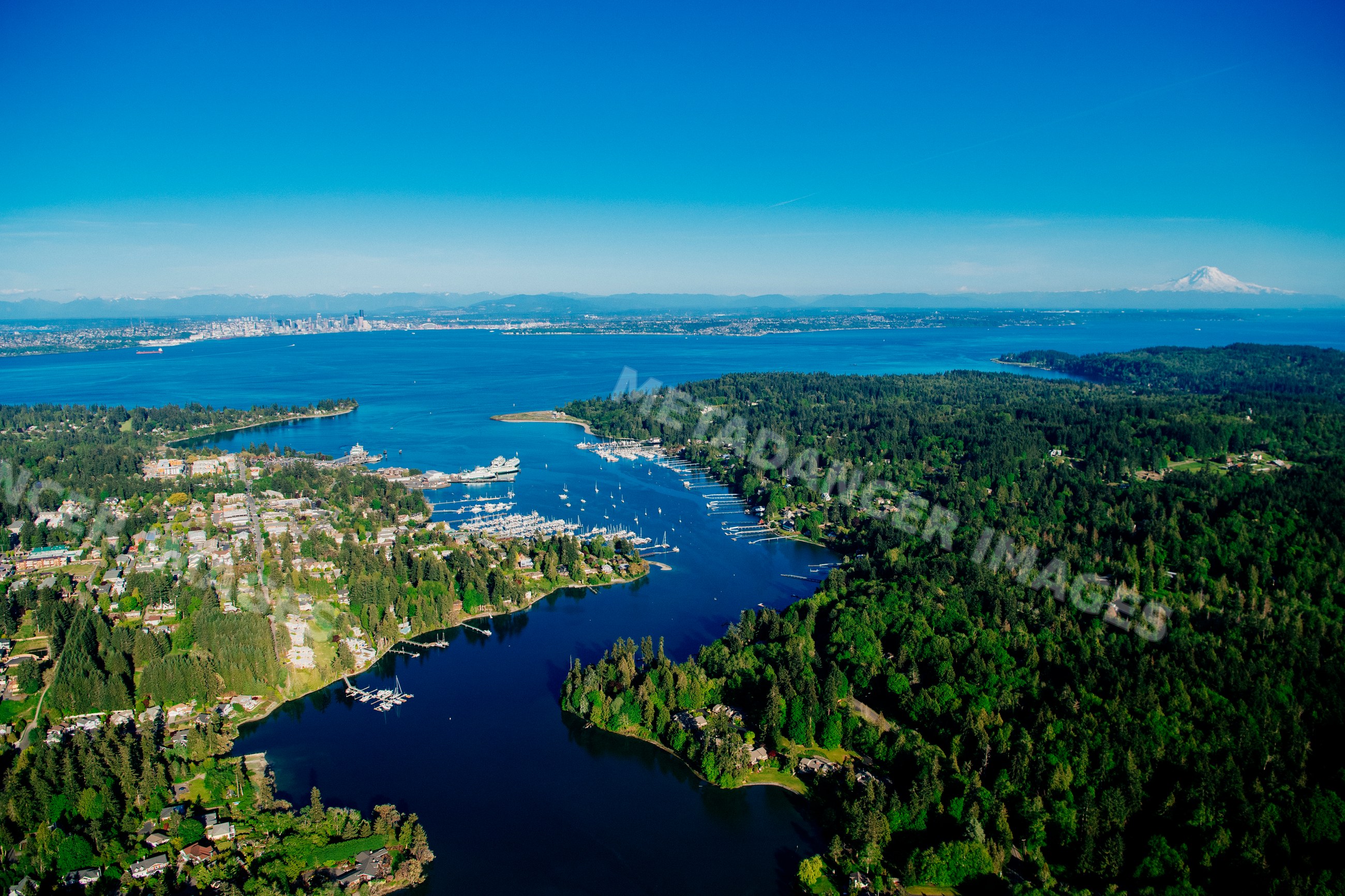 Aerial view of Bainbridge Island's Eagle Harbor marina with seattle