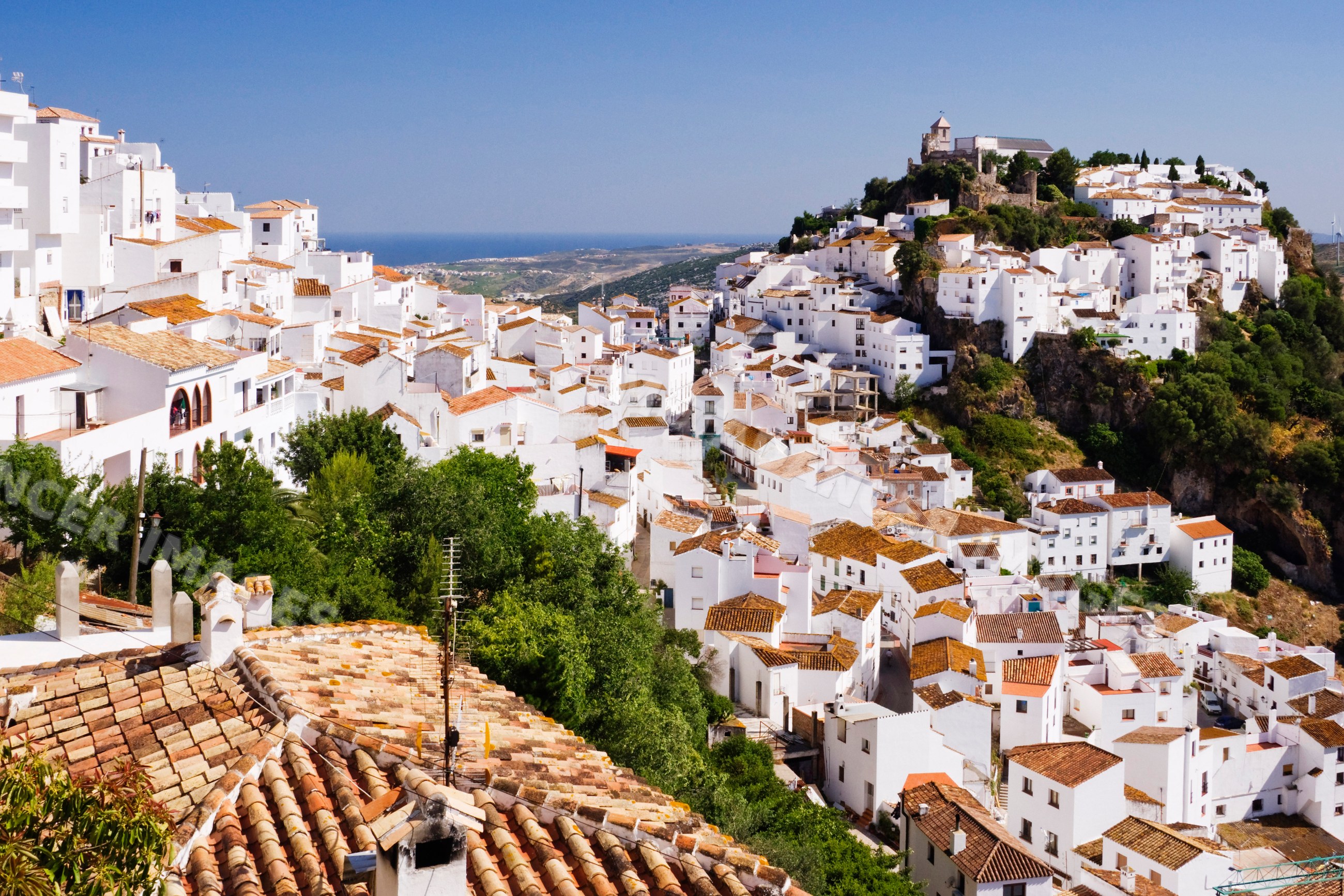 Scenic hilltop village of whitewashed buildings and historic fortress