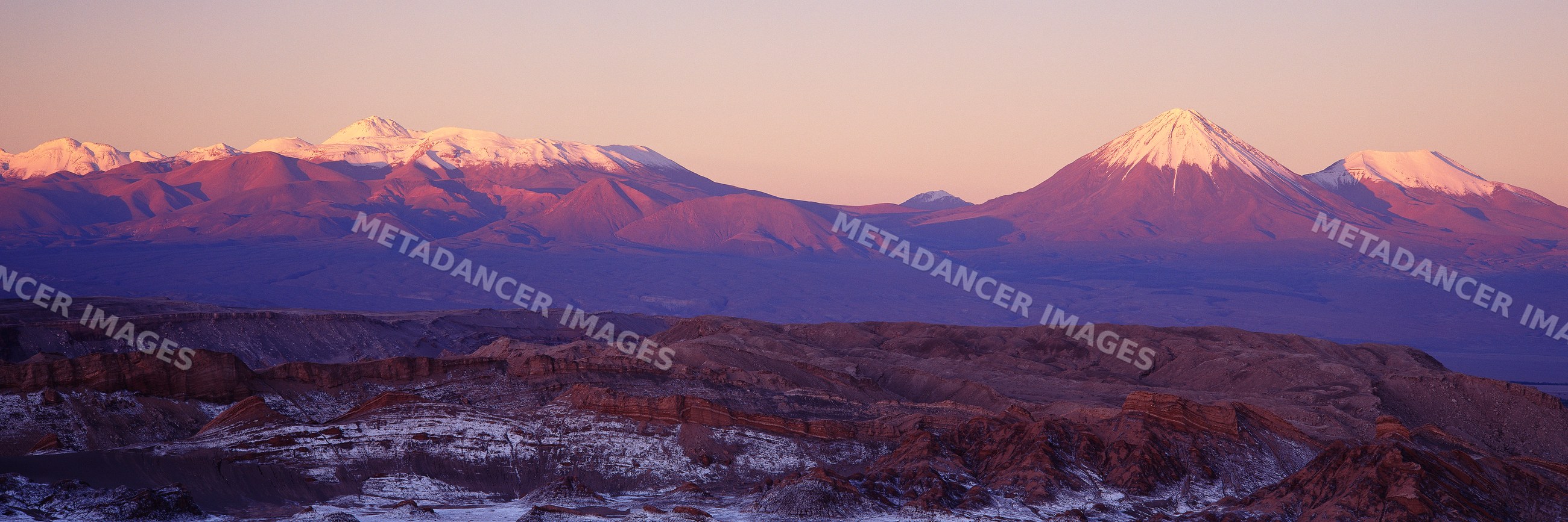 Valle de la luna and licancabur volcano landscape at sunset